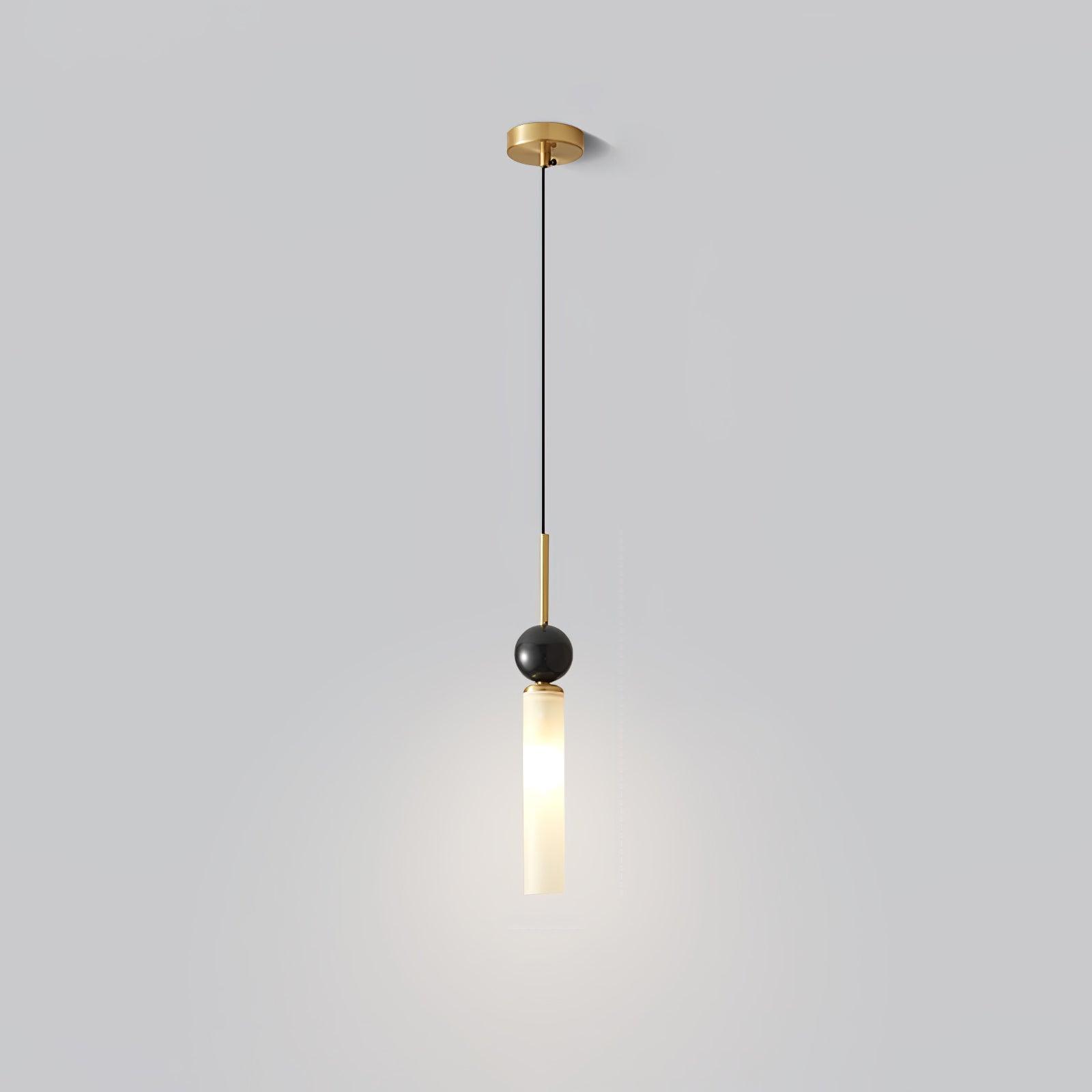 Full single pendant with brass-tone canopy and stem, black cable, dark sphere and glowing white tube on pale background