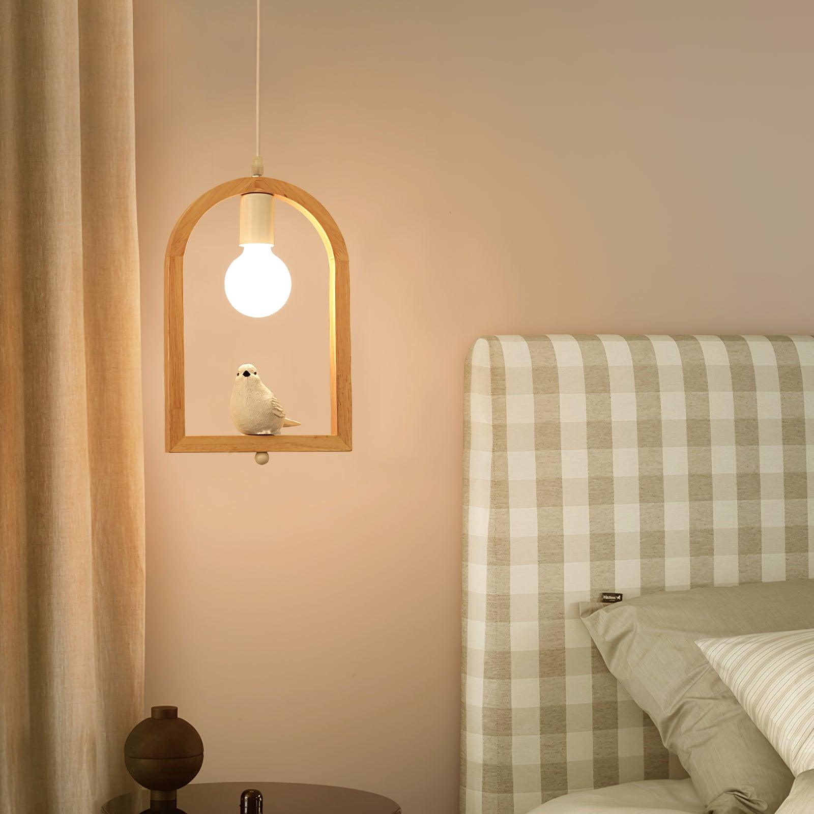 Bird arch pendant beside a bed