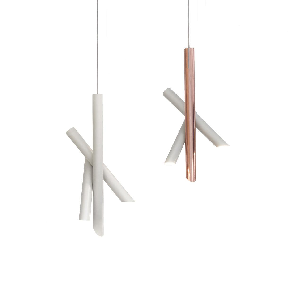 White and rose-gold Tubes pendants shown side by side at different hanging heights