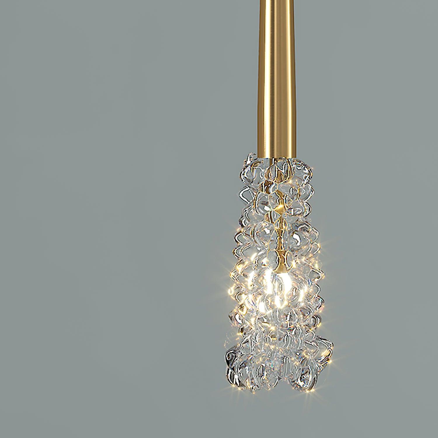 Illuminated raised-texture clear shade beneath a Gold stem