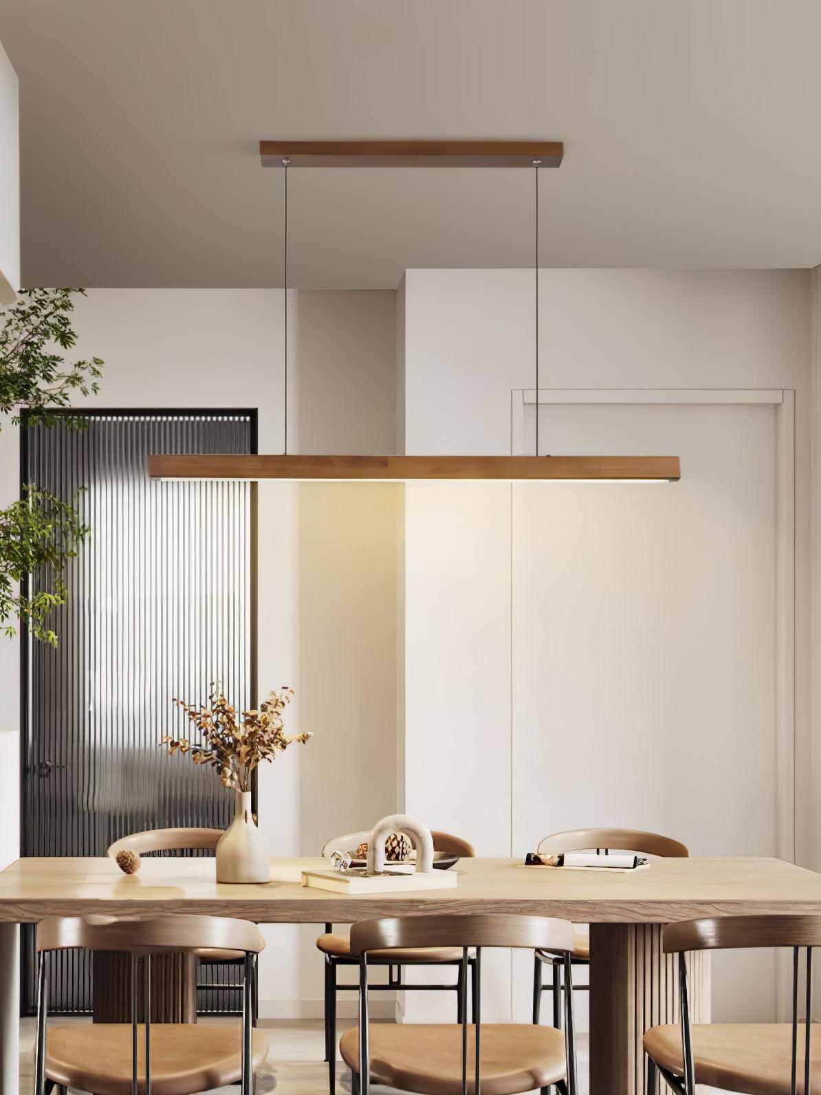 Long Walnut-colour bar pendant above a table