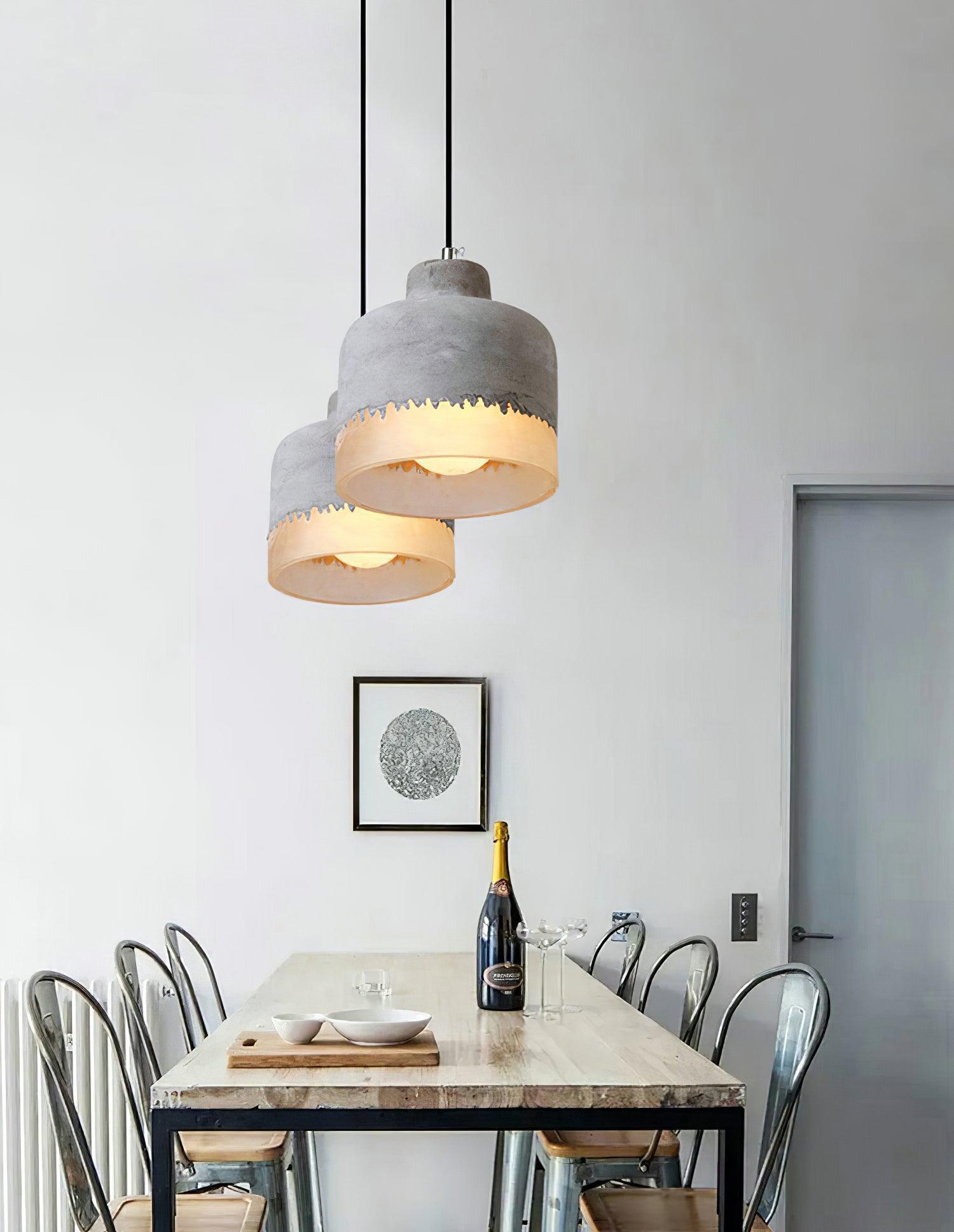 Pair of rounded shades hanging at different heights