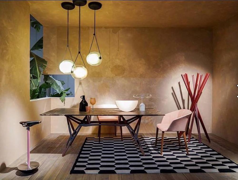 Grouped glass pendants above a dining table