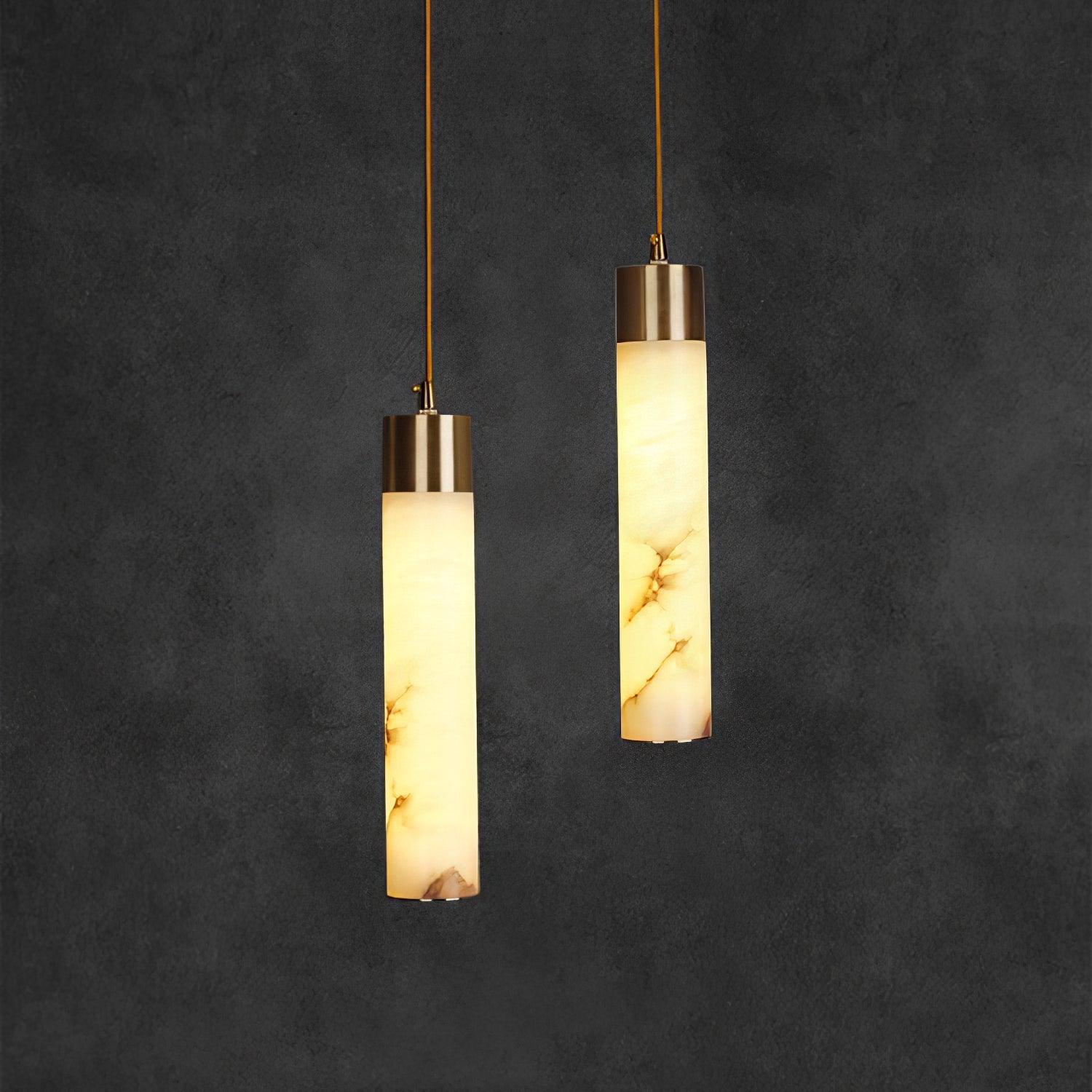 Two illuminated alabaster tube pendants at different heights