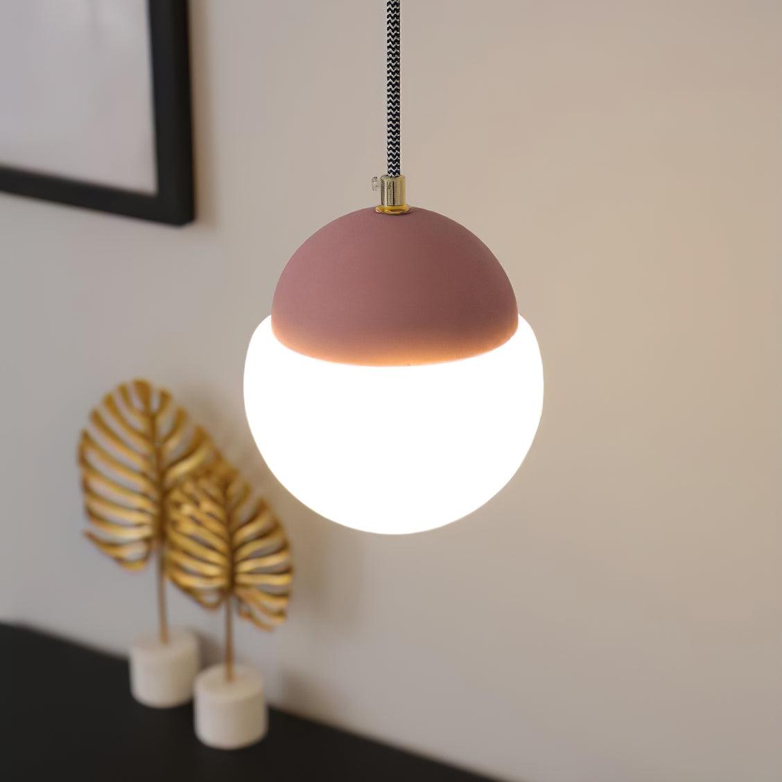 Pink cap above a White globe shade