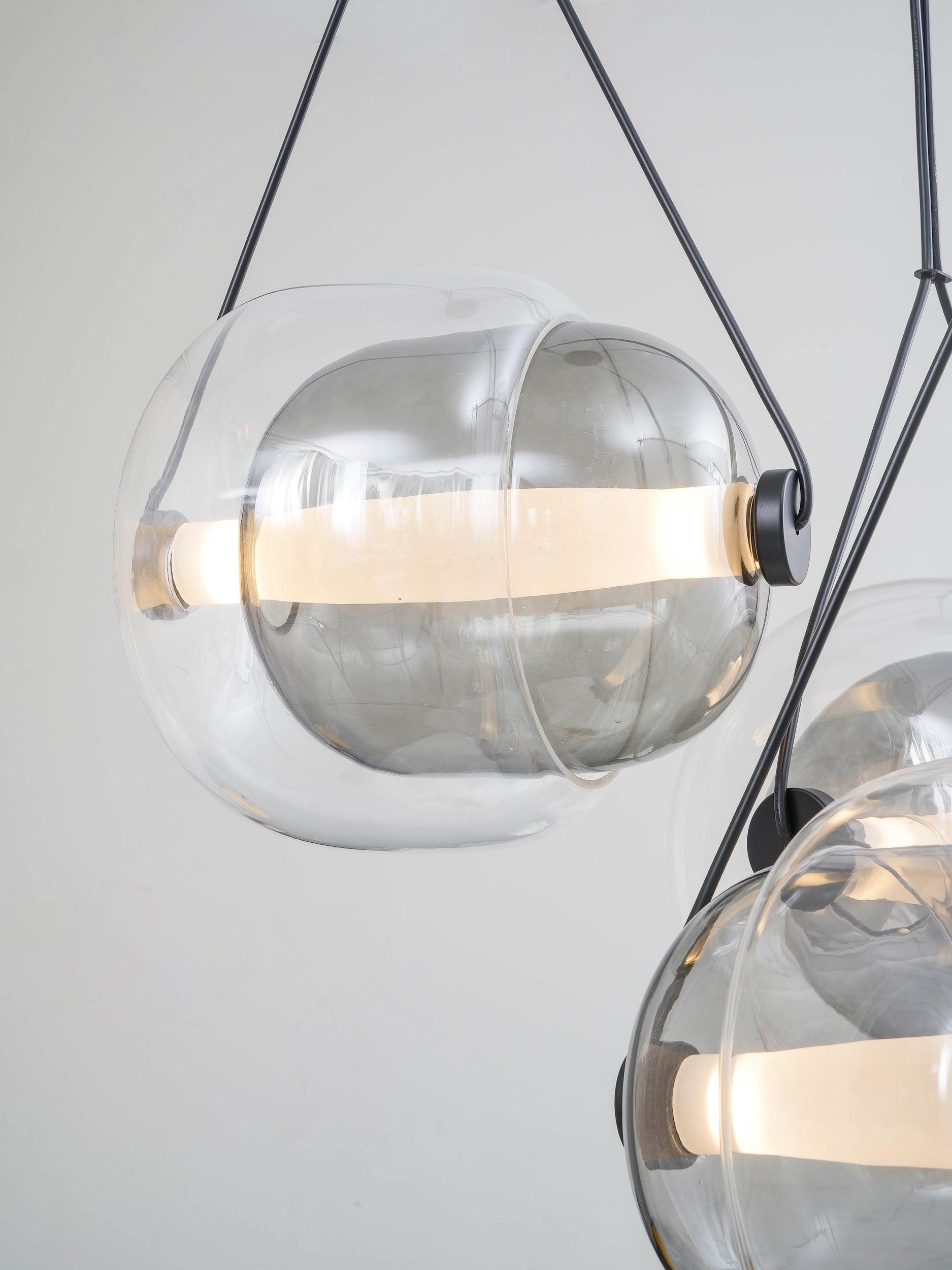 Layered clear glass capsule with dark end caps