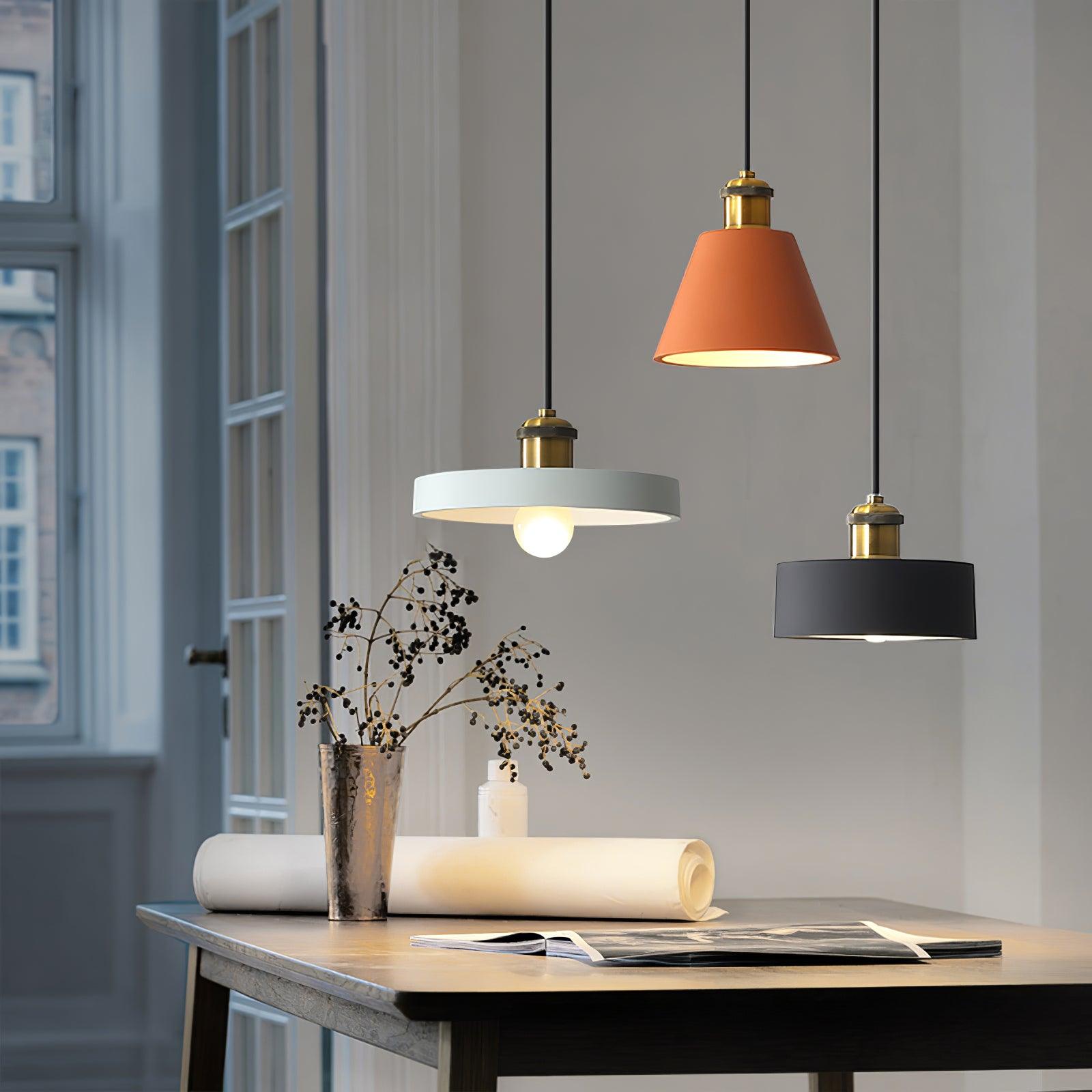 Geometric pendants in a dining-room arrangement