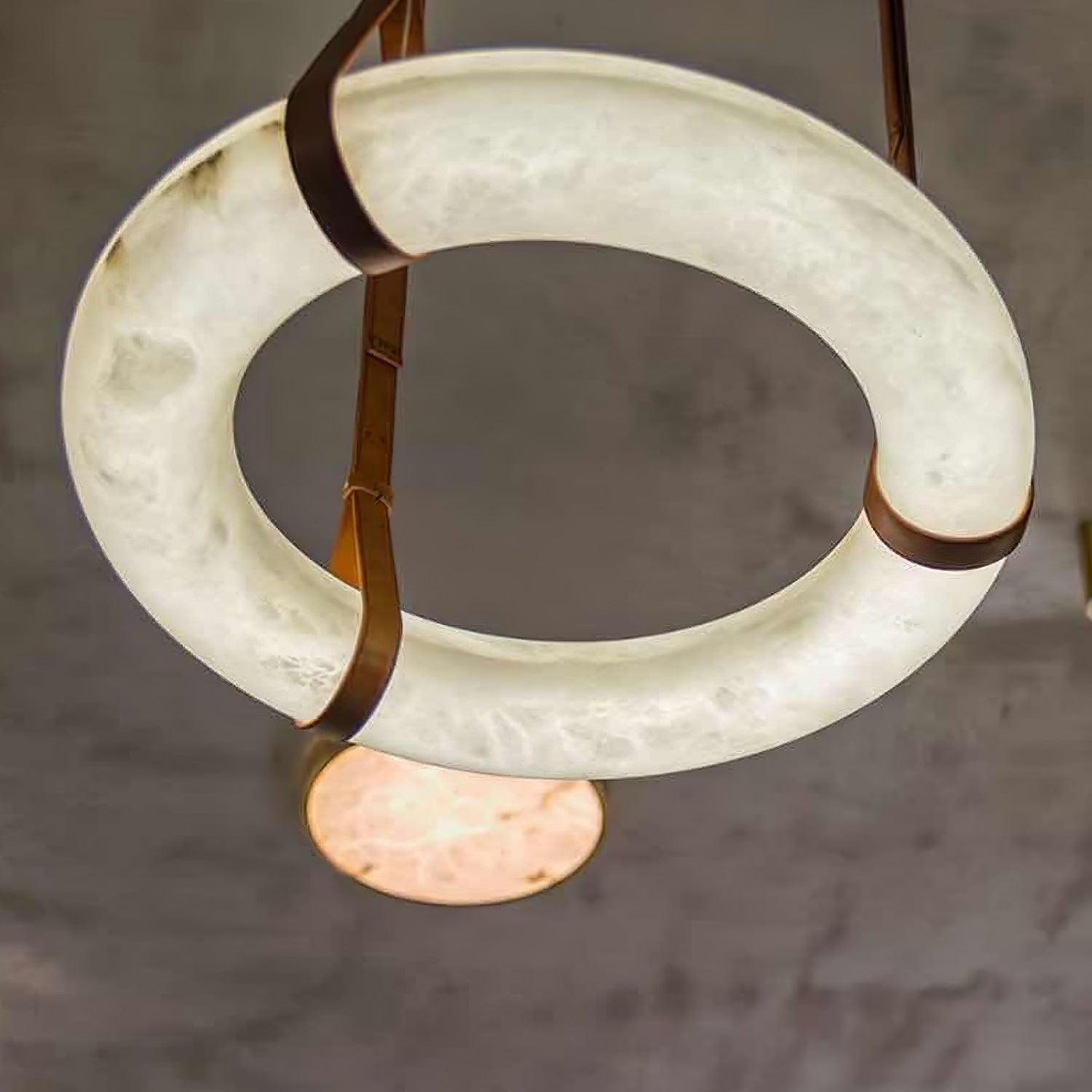Underside of a ring pendant with brown straps