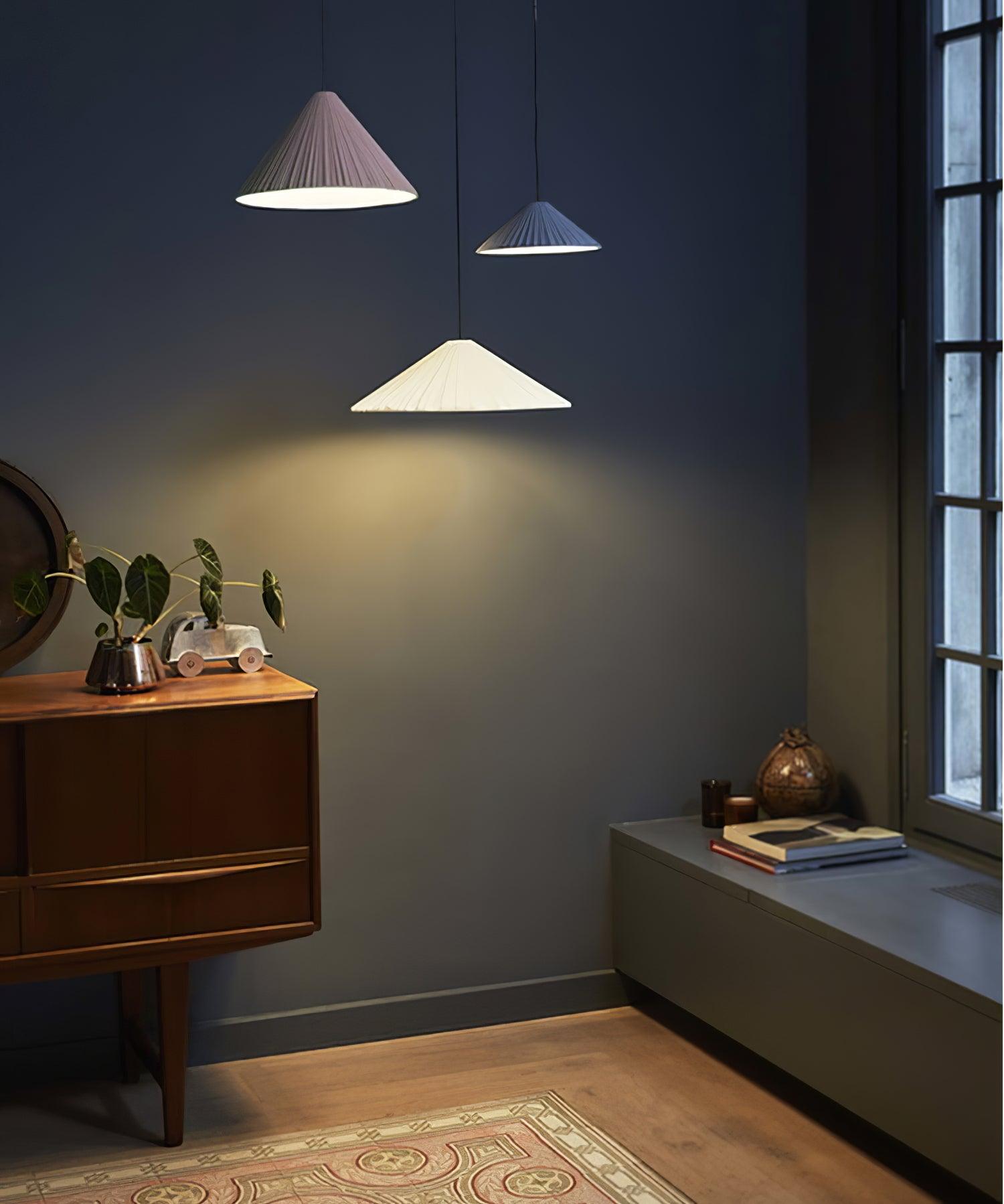 Coloured Hat pendants in a dark living room