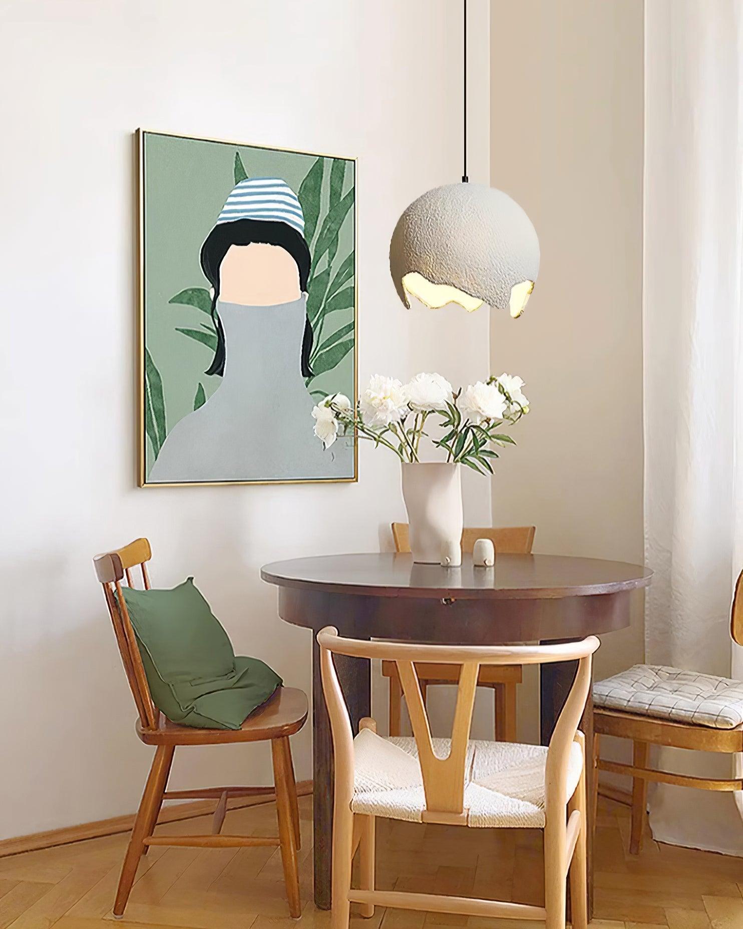 Pale textured globe above a small round table