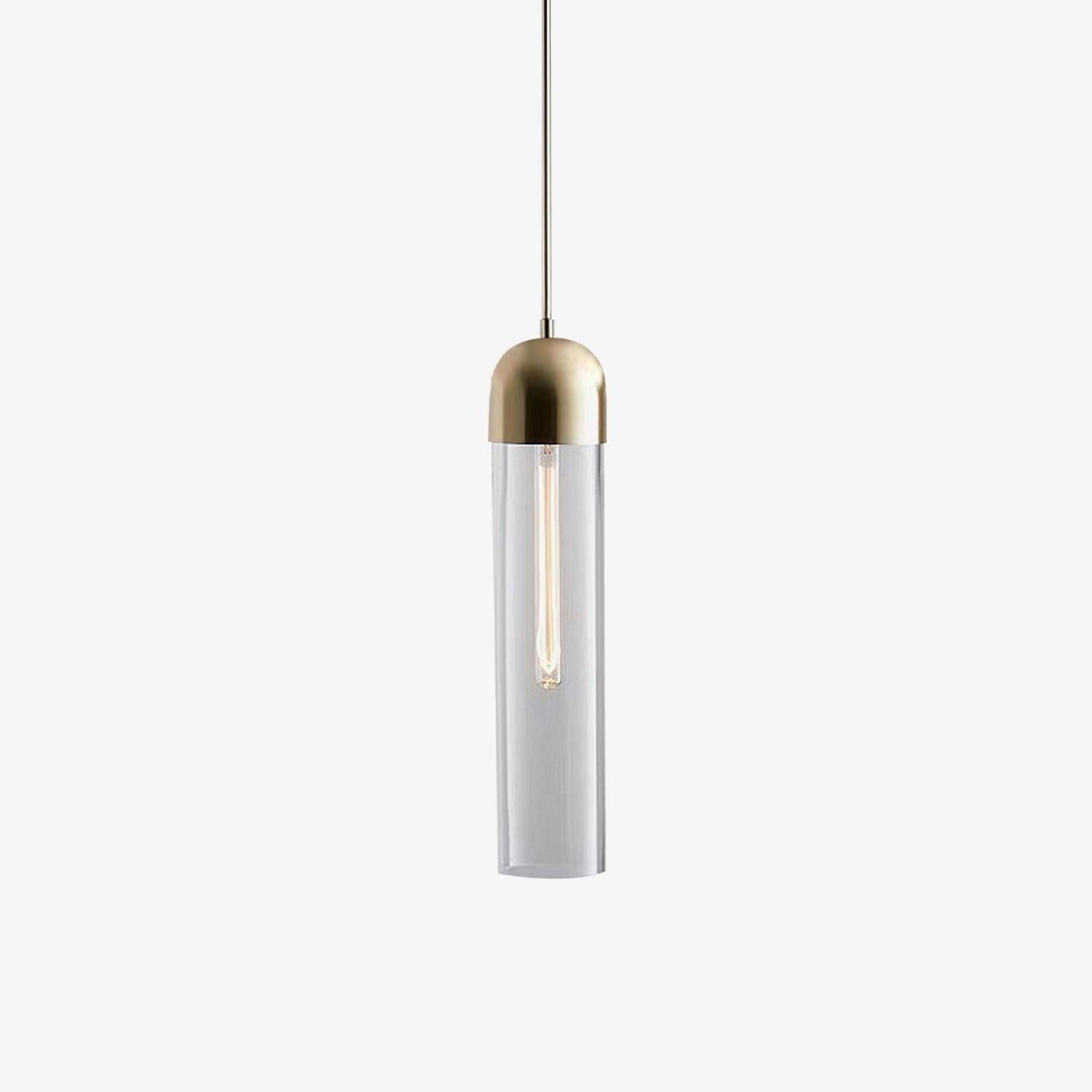 Clear cylindrical glass pendant with gold-tone cap and elongated bulb on pale grey