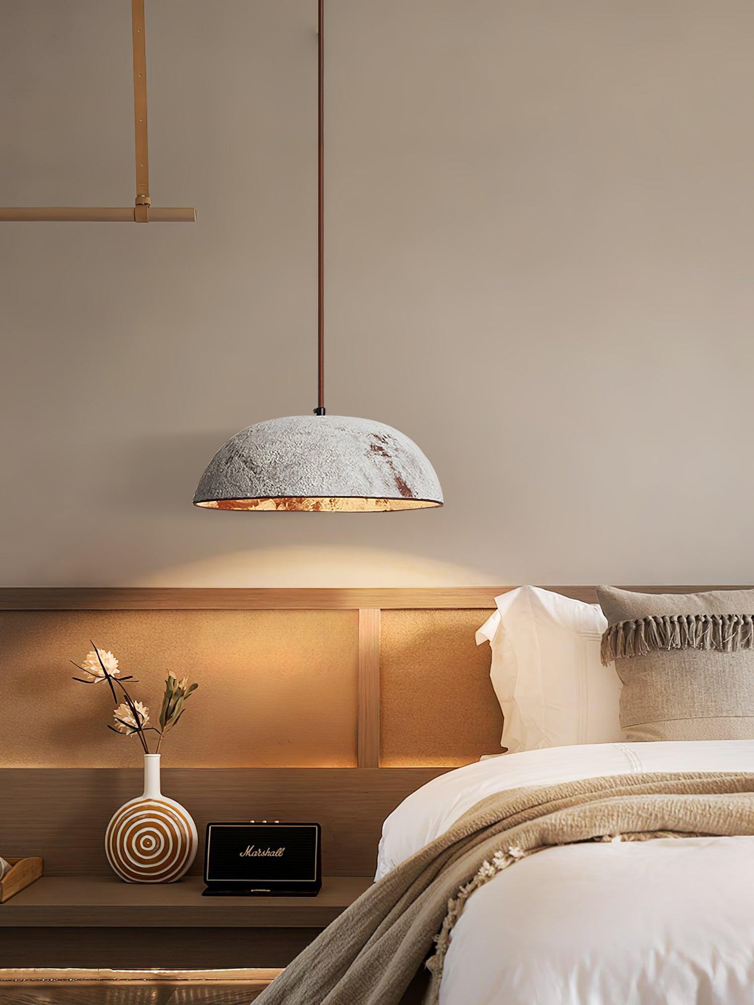Pale ceramic dome above a bedside cabinet