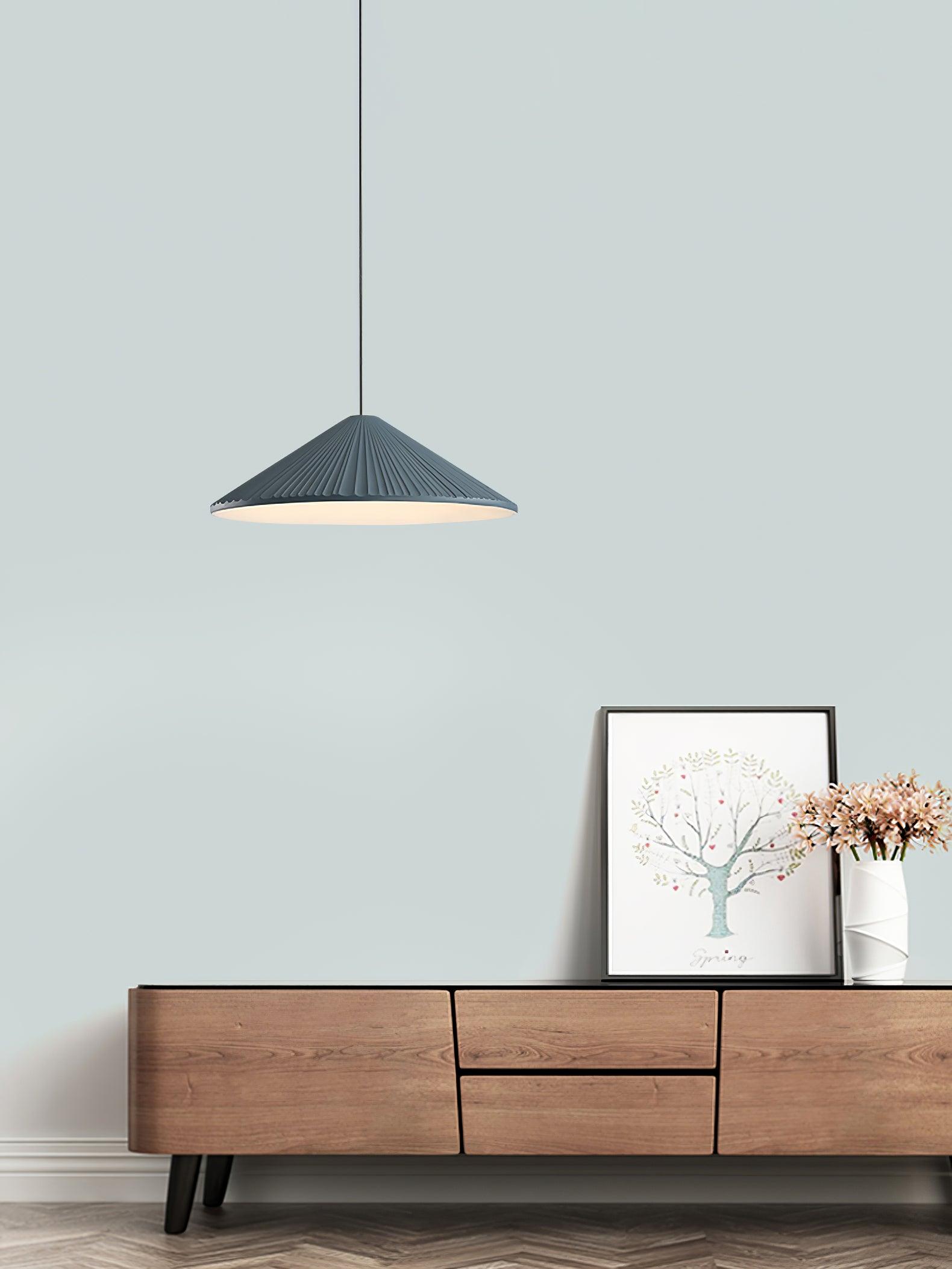 Blue Hat pendant above a low console