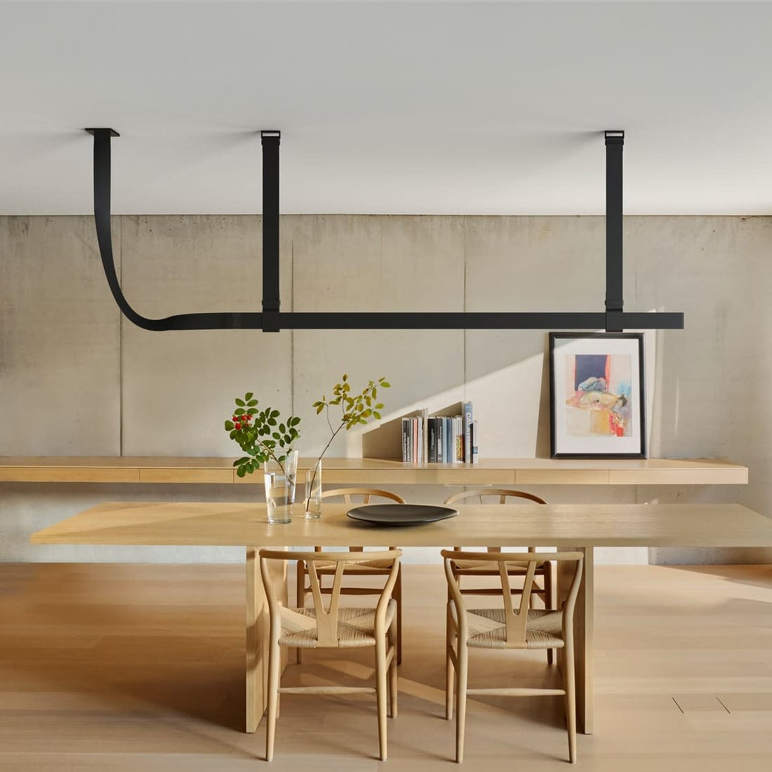 Black Belt fixture above a light wooden table