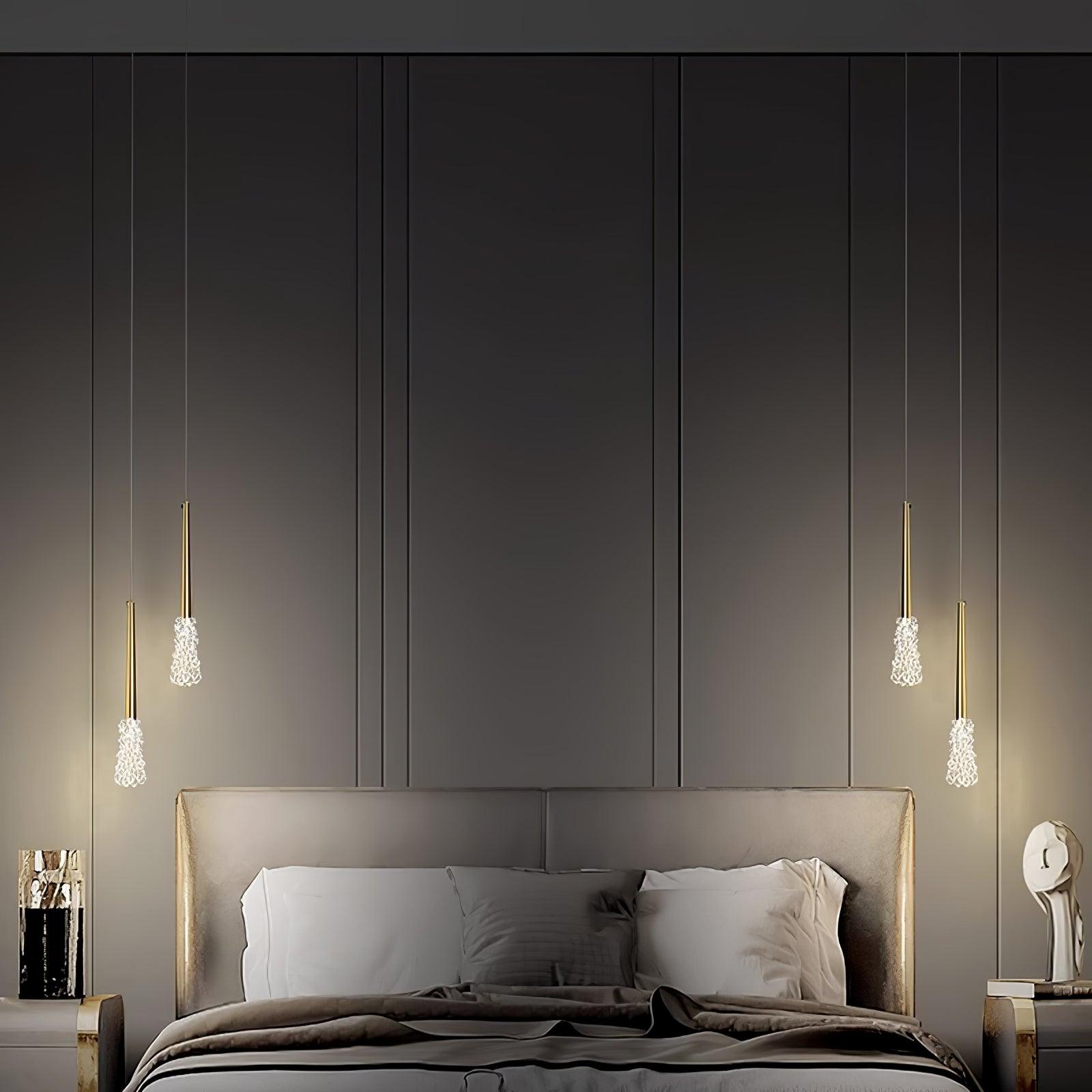 Gold textured pendants in a dark bedroom