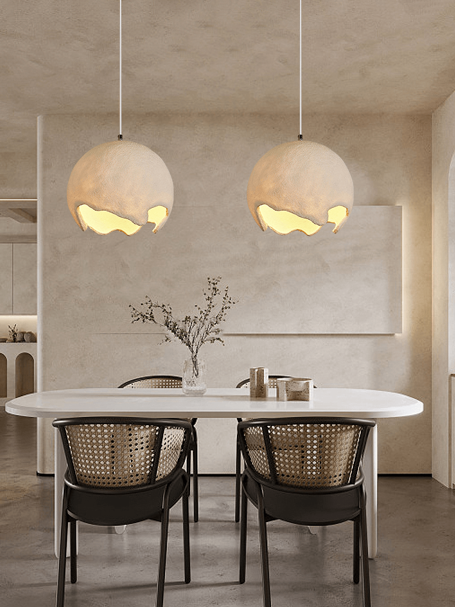 Two beige pendants above a dining table