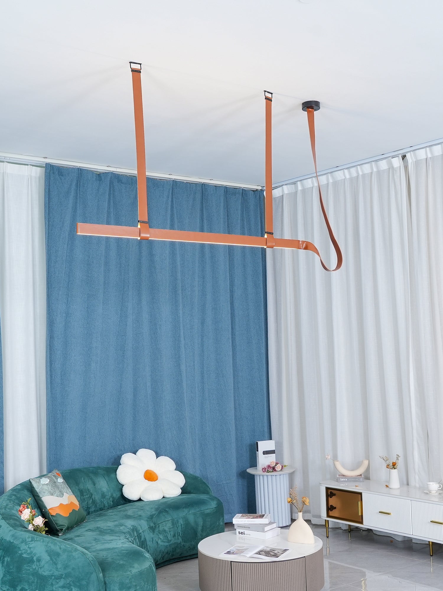 Brown Belt pendant in a bright blue-curtained room