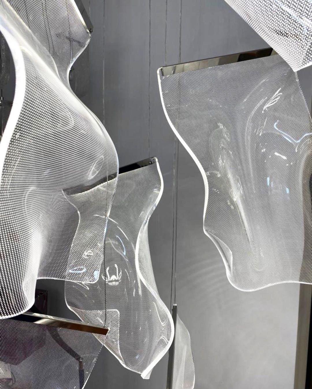 Dotted acrylic surfaces and metal upper strips viewed close up