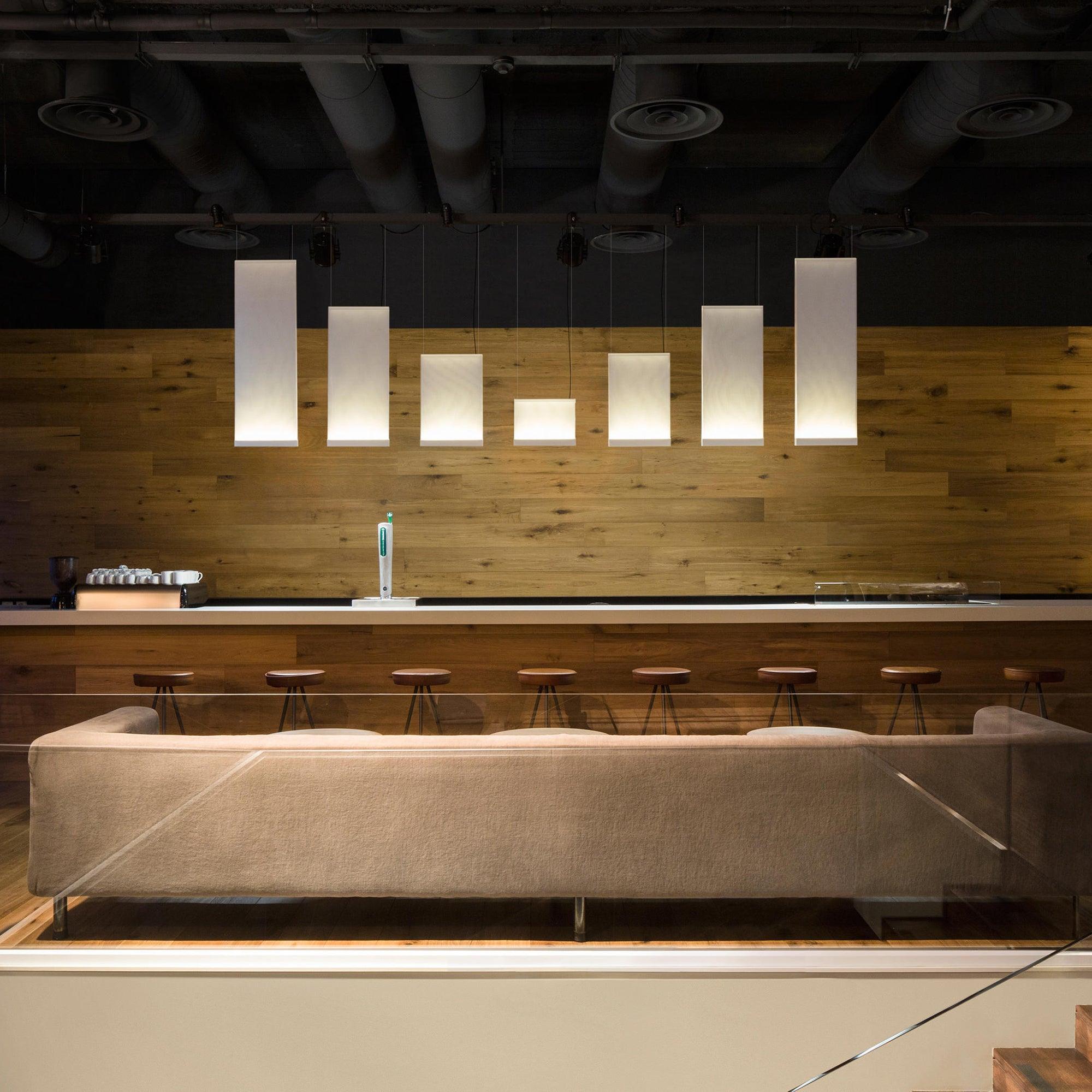 Varied panel heights above a long interior counter