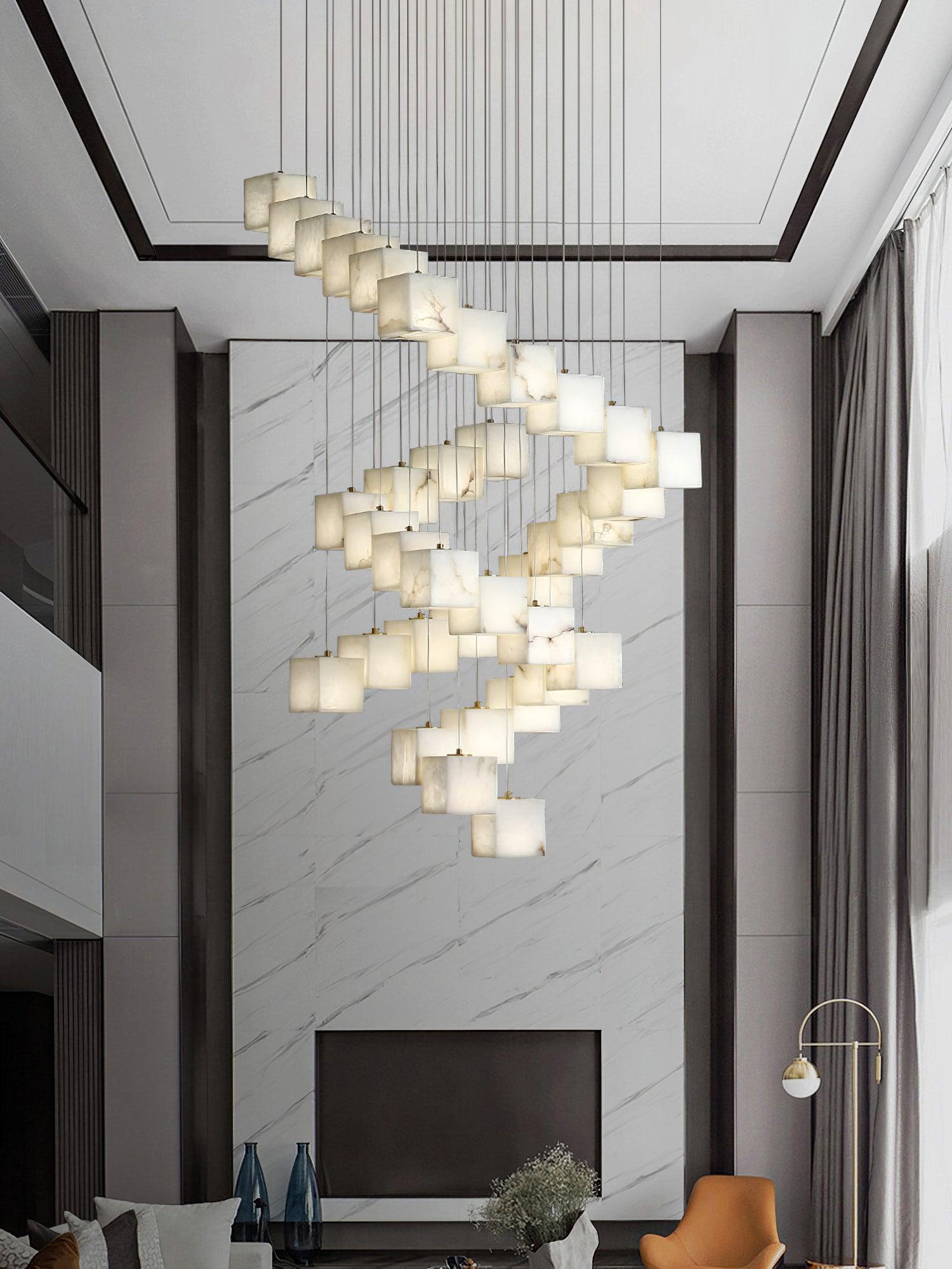 Tall spiral cube pendant above a seating area with a fireplace