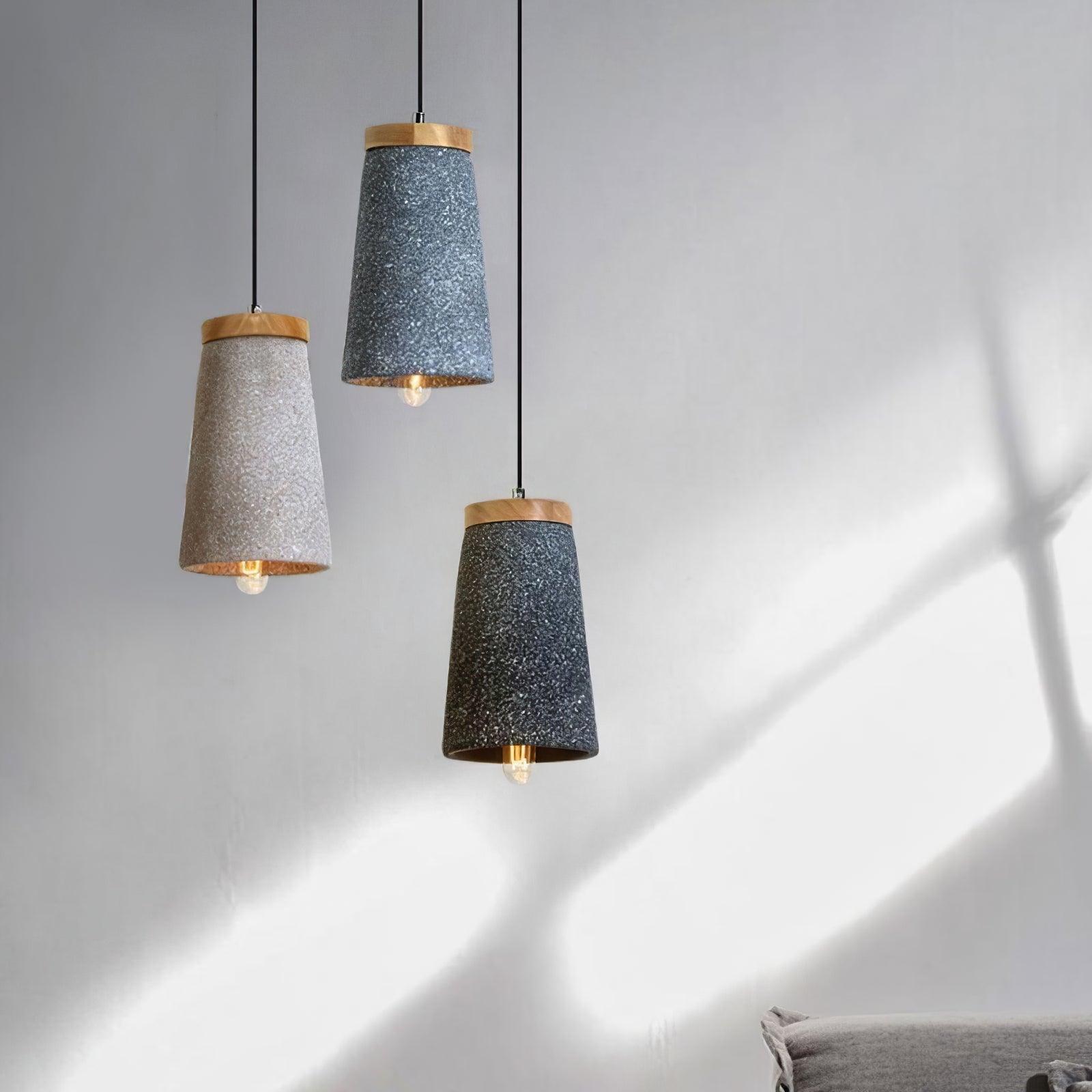 Three cement pendants at staggered heights
