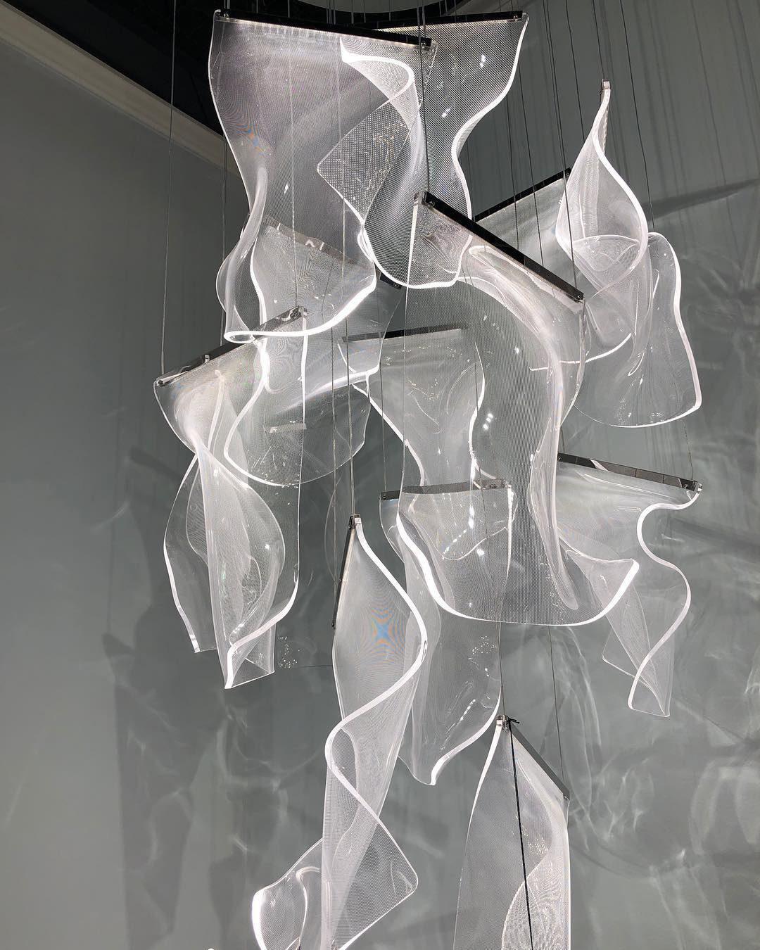 Transparent acrylic sheets hanging at staggered heights
