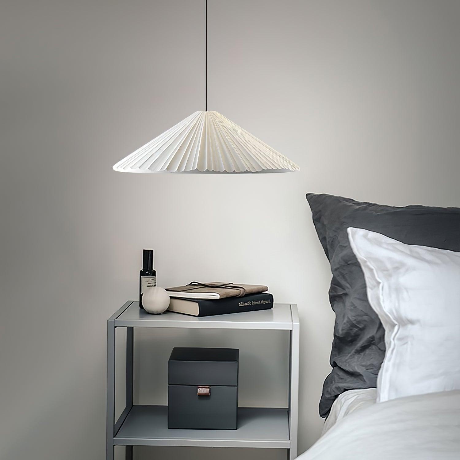 White Hat pendant above a bedside table