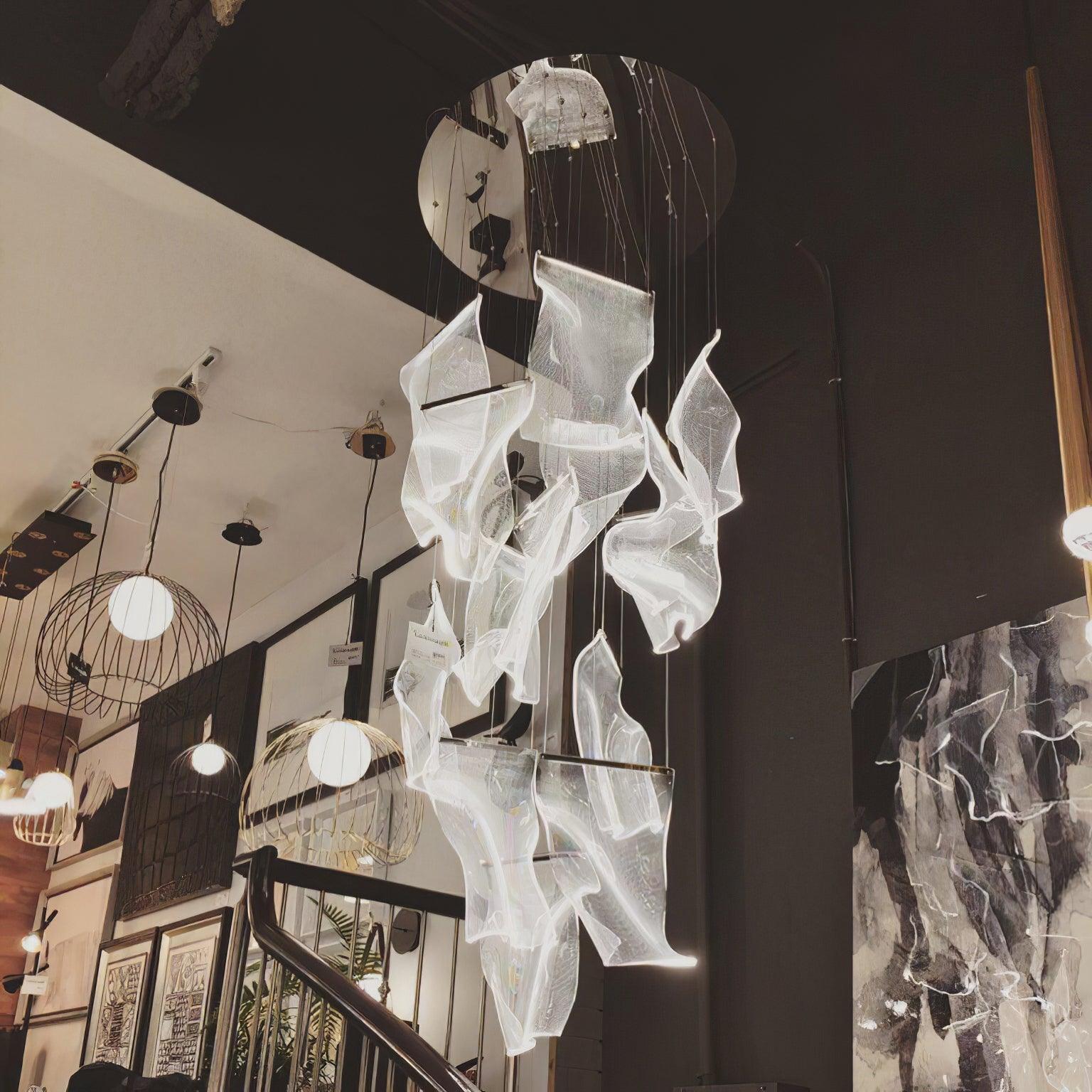 Acrylic cascade beside a staircase in a showroom