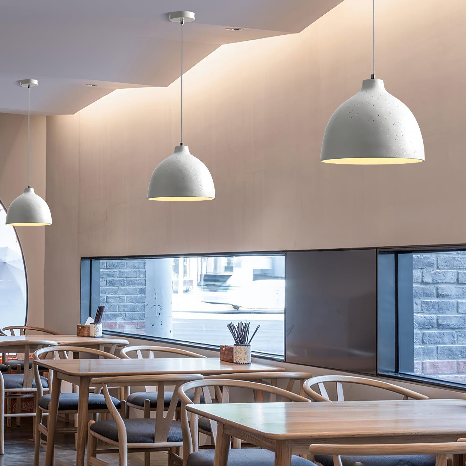 White bowl pendants in a dining interior
