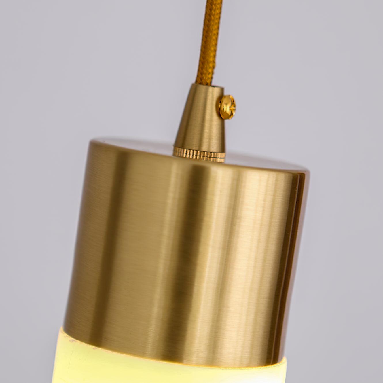 Close-up of brass cap, cord entry and small fastener