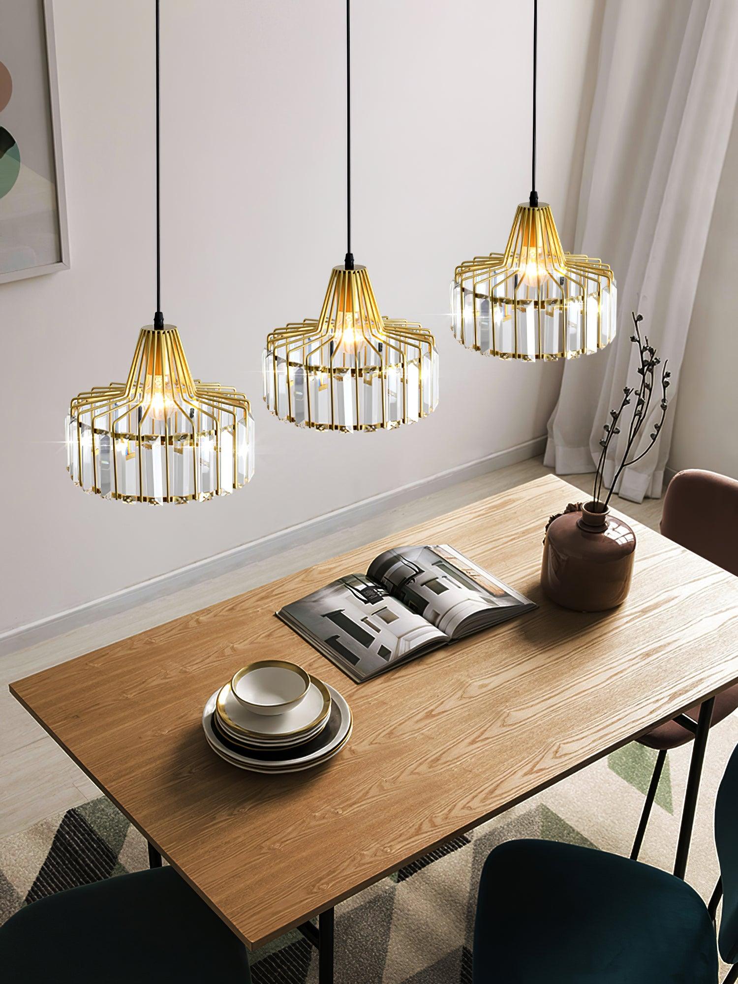 Gold-coloured pendant group above a set dining table