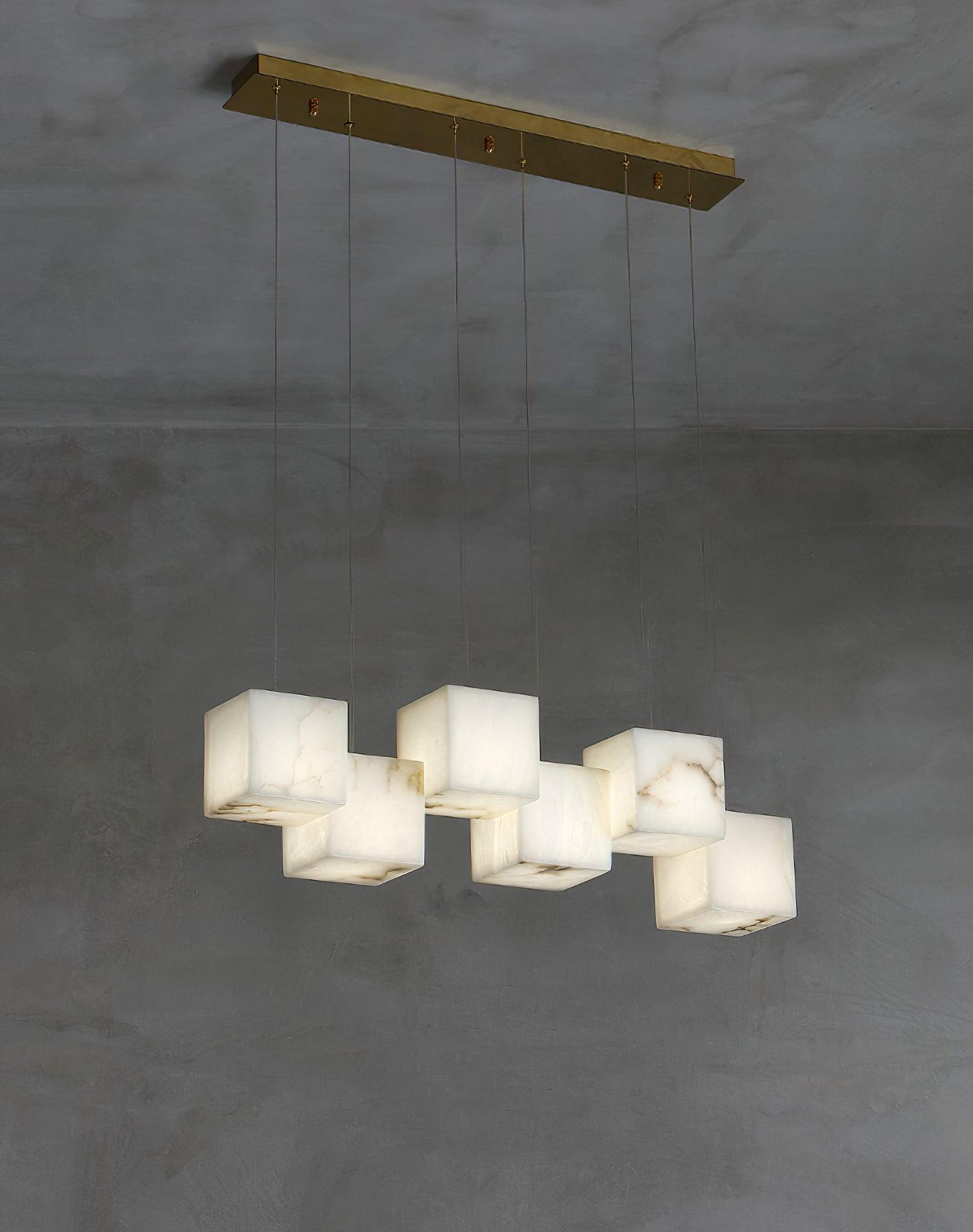 White cubes aligned below a long Gold canopy