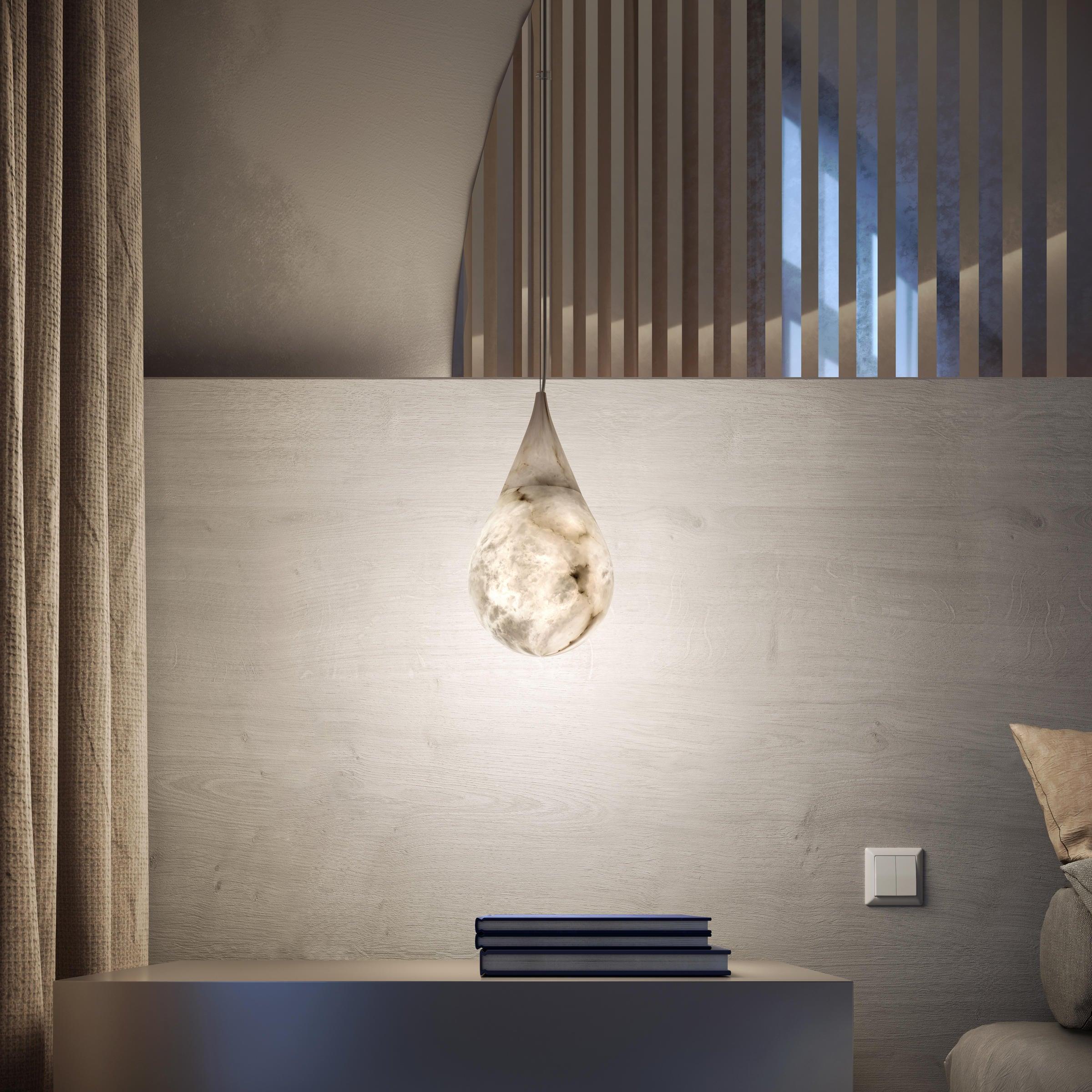 Marble Raindrop light above a dark bedside cabinet