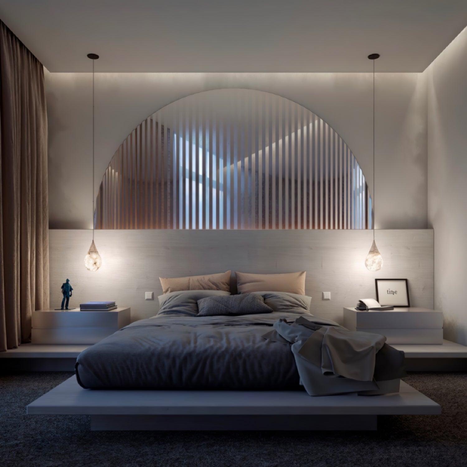 Marble pendant arrangement on either side of a bed