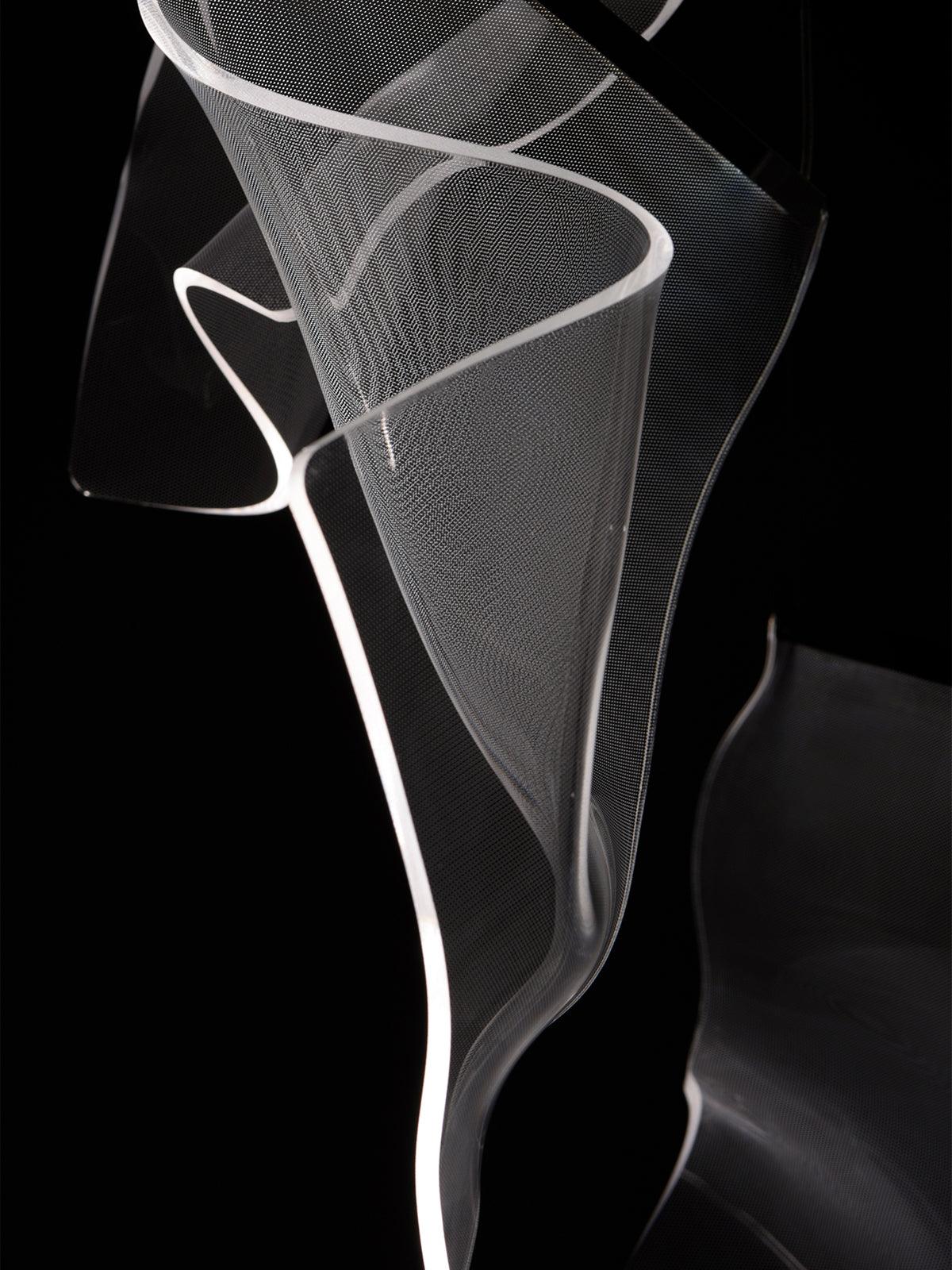 Single wavy acrylic sheet outlined against a dark background