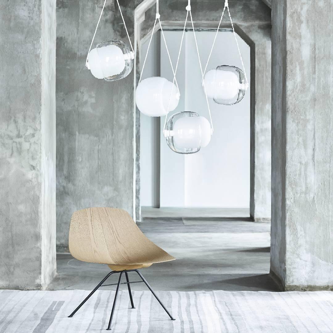 White and clear pendants in a concrete interior