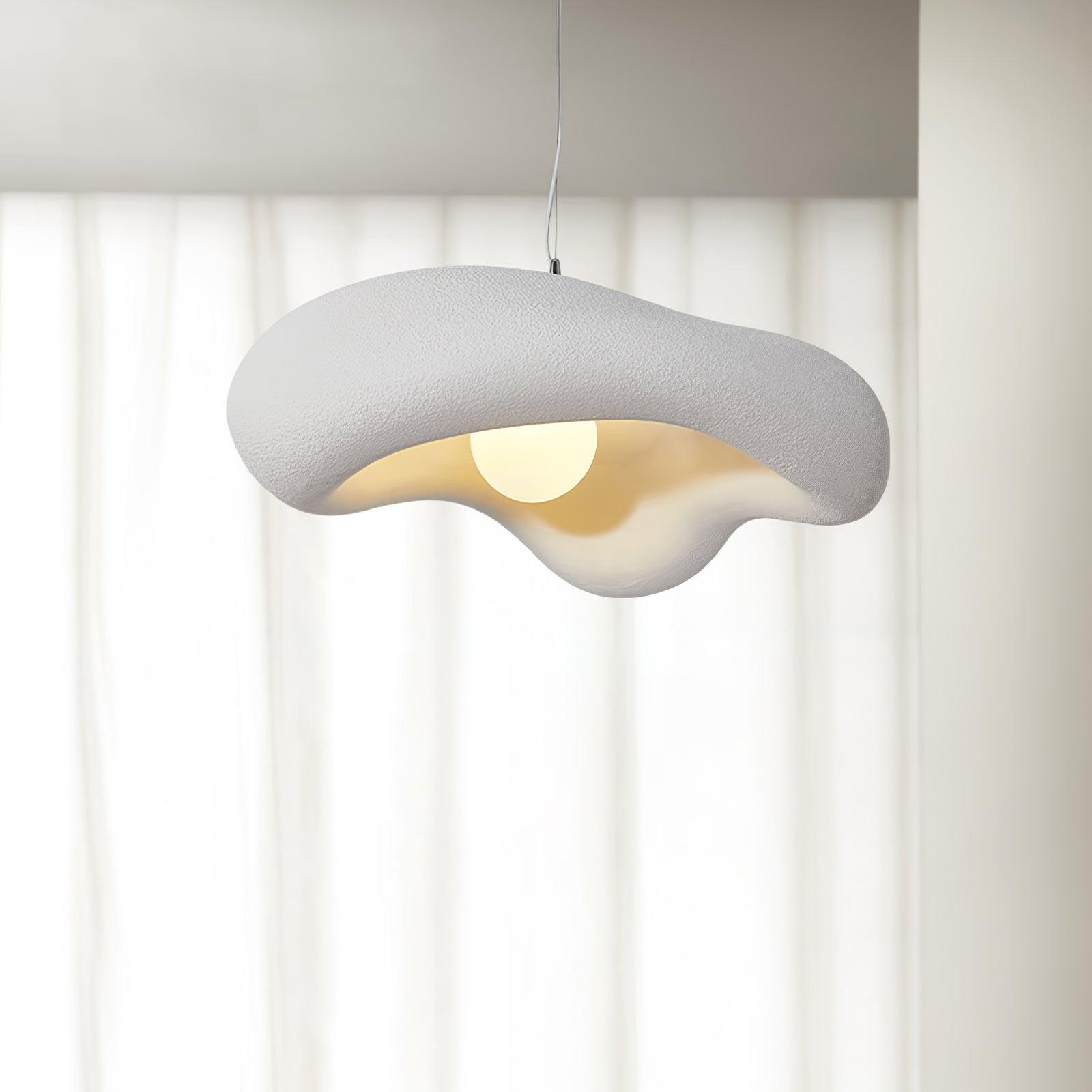 White wavy shade in front of a bright window