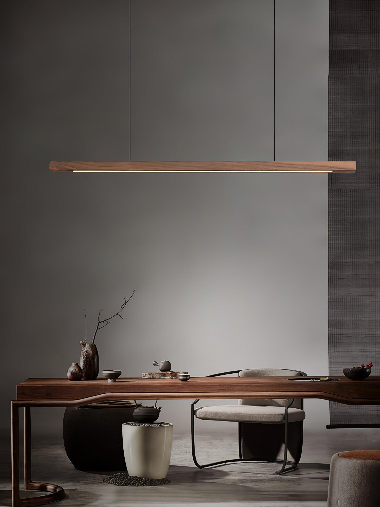 Walnut-colour bar pendant in a desk arrangement