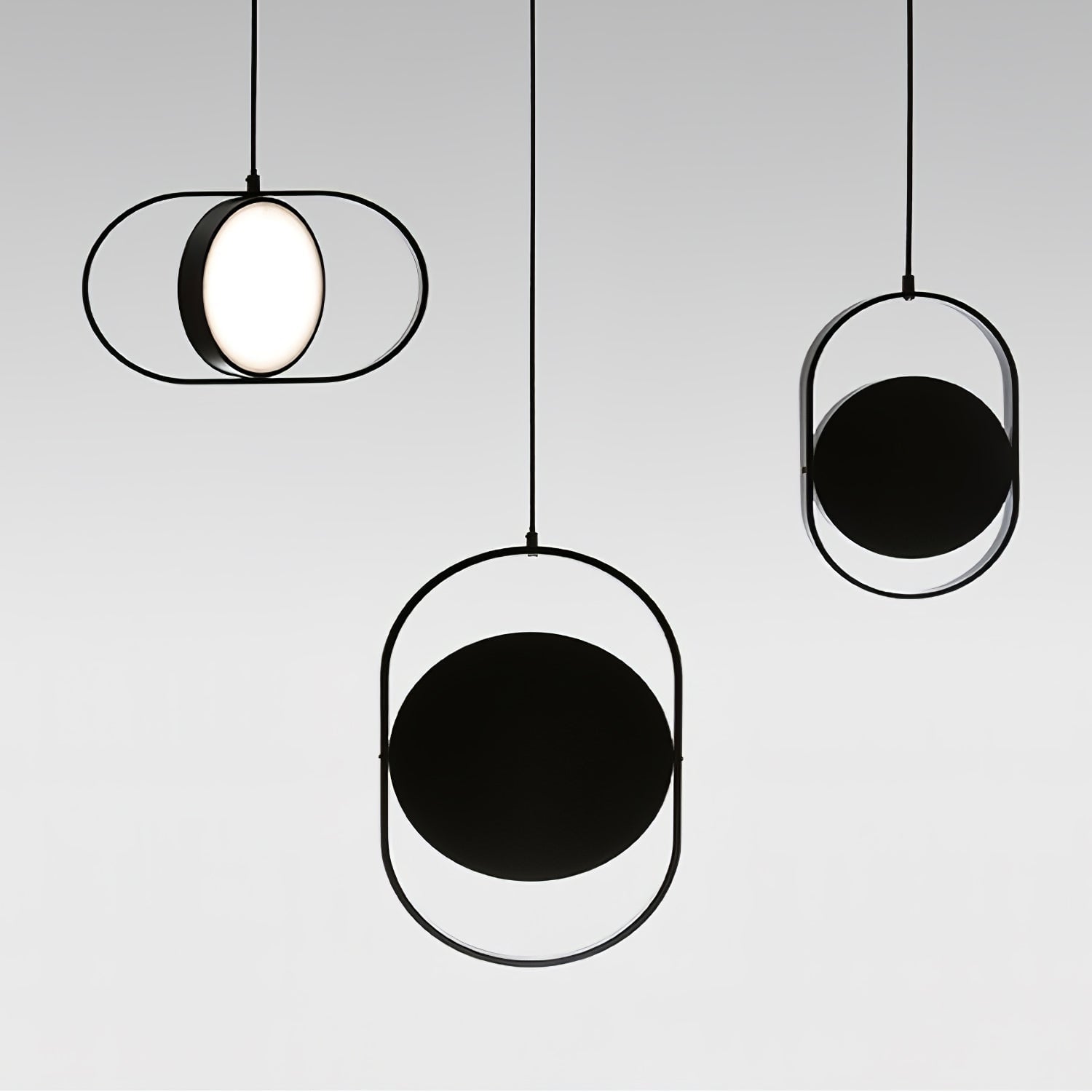 Three Black oval frames with circular discs