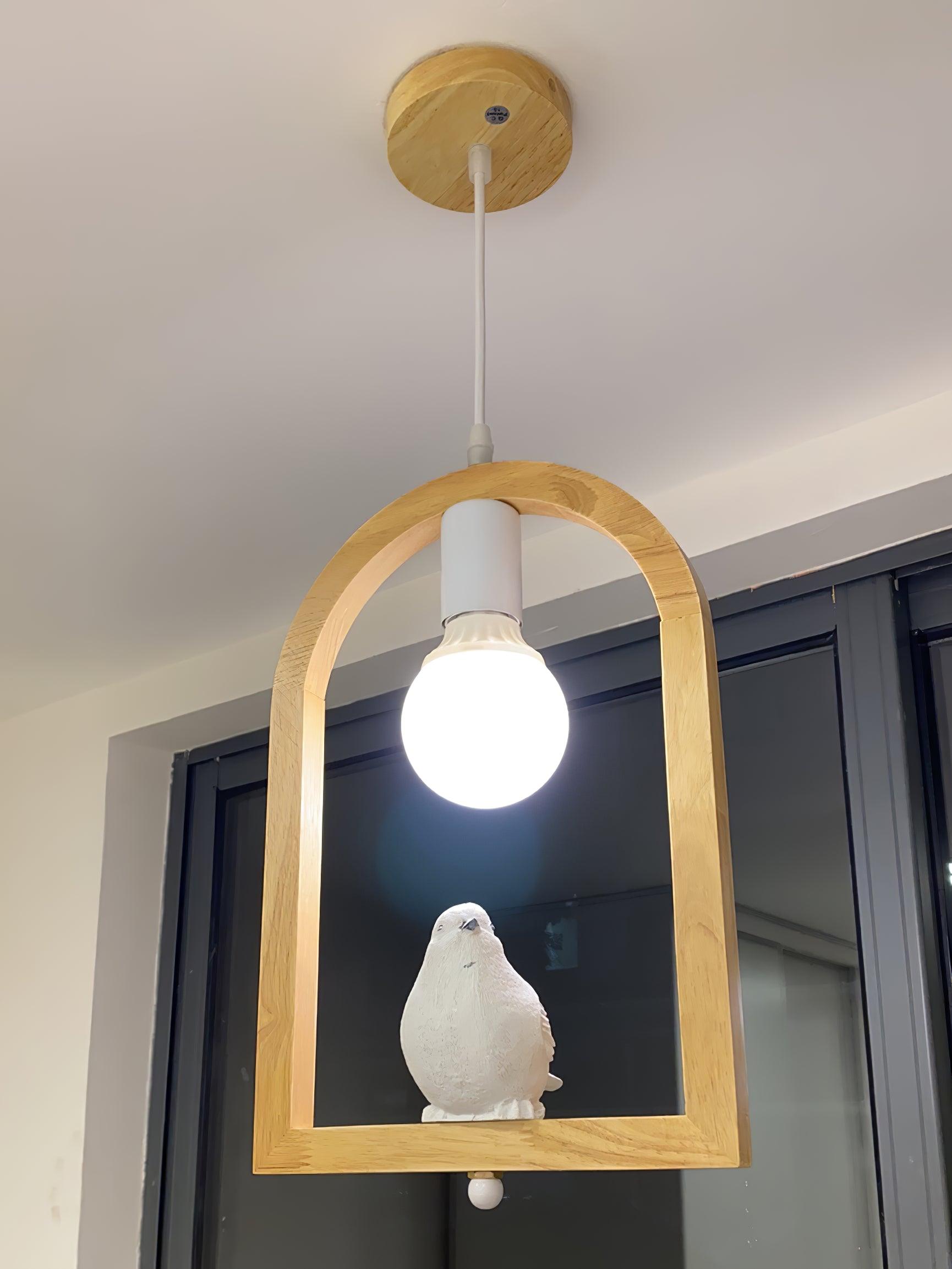 Bird pendant beneath a wood-toned canopy