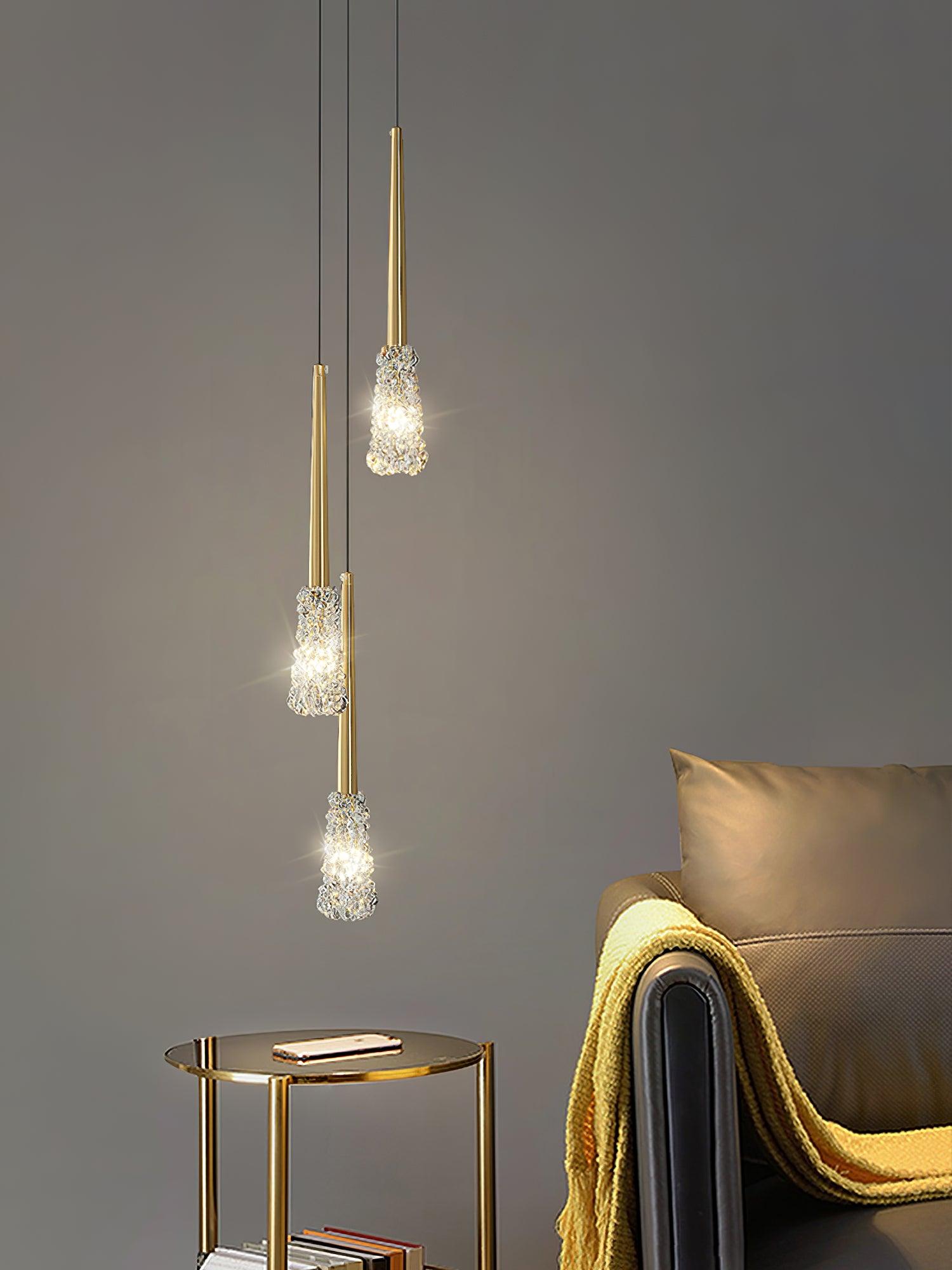 Gold pendant group above a small side table