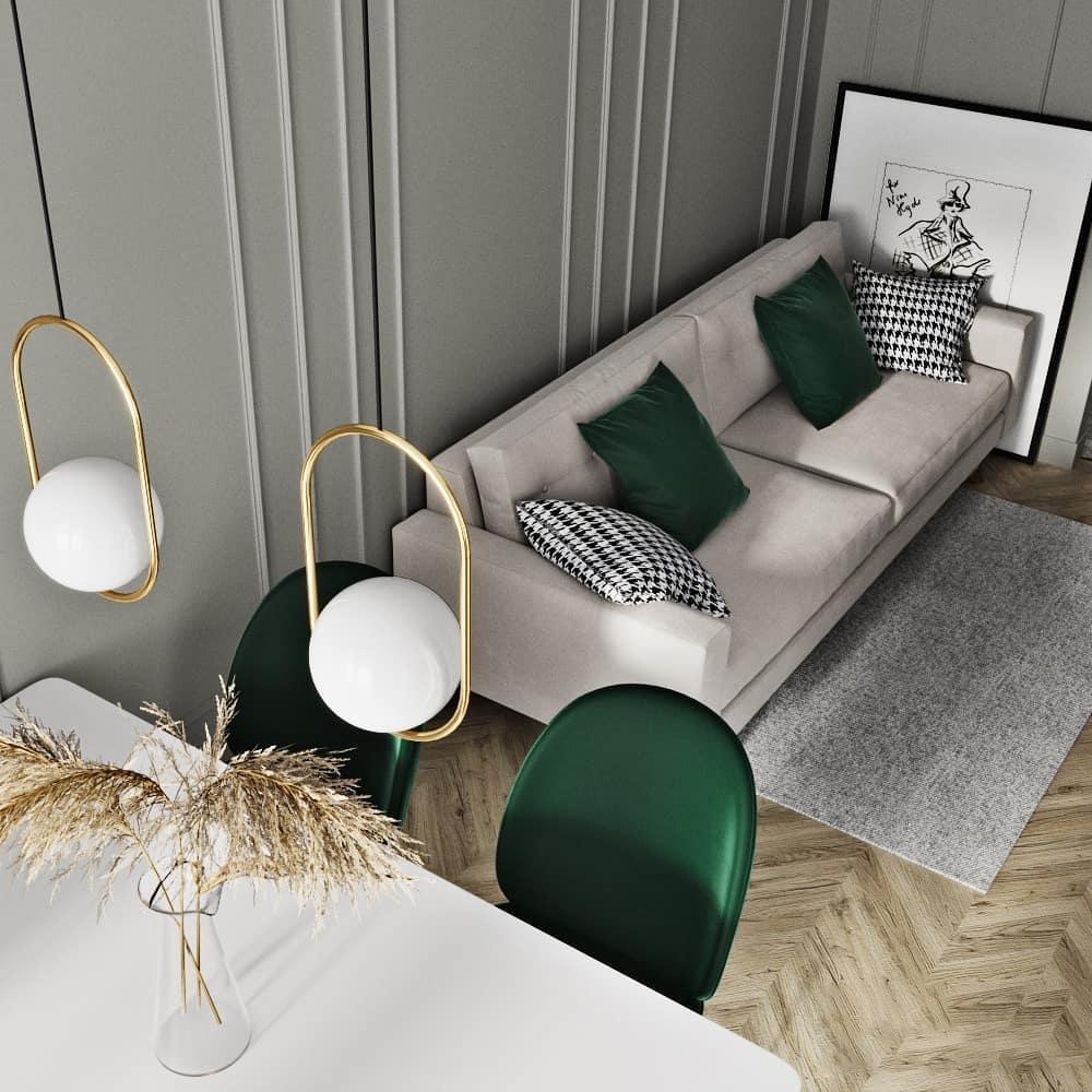 Oval frame pendants above a table beside a sofa