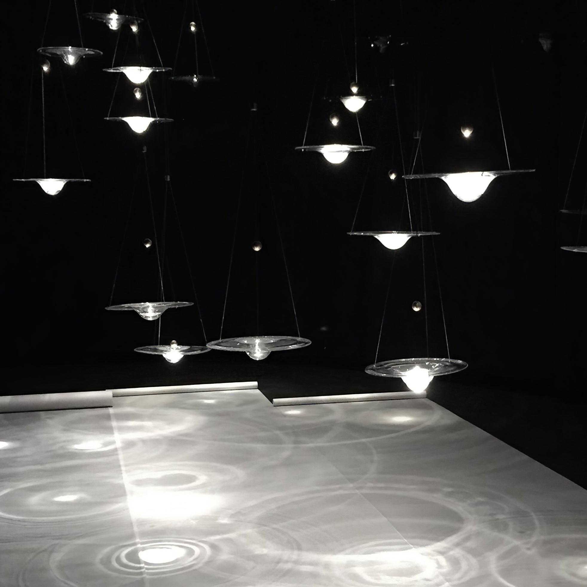 Clear glass pendants over a light tabletop