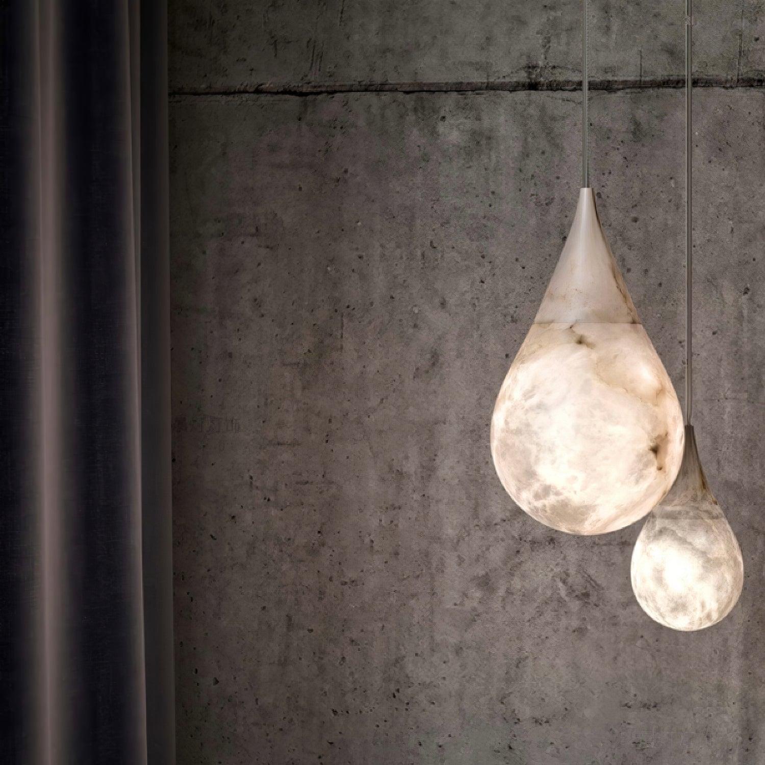 Two marble droplet lights near a concrete wall
