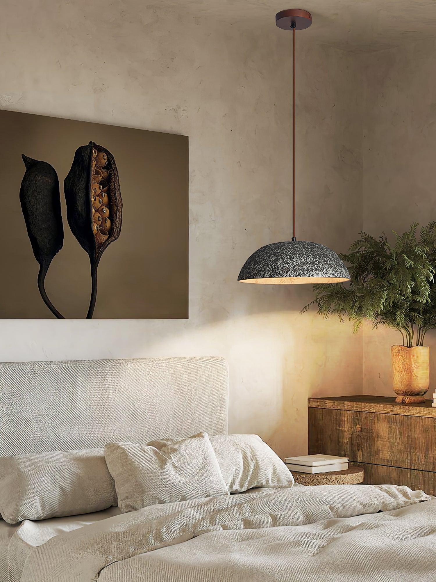 Dark ceramic dome beside a bed and plants