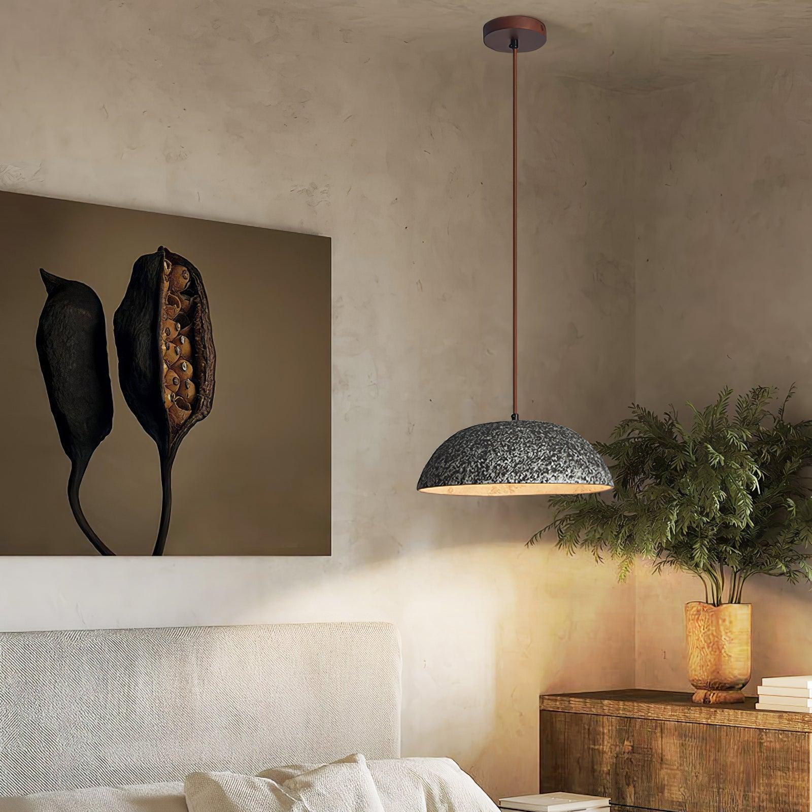 Black textured dome above a bedside setting