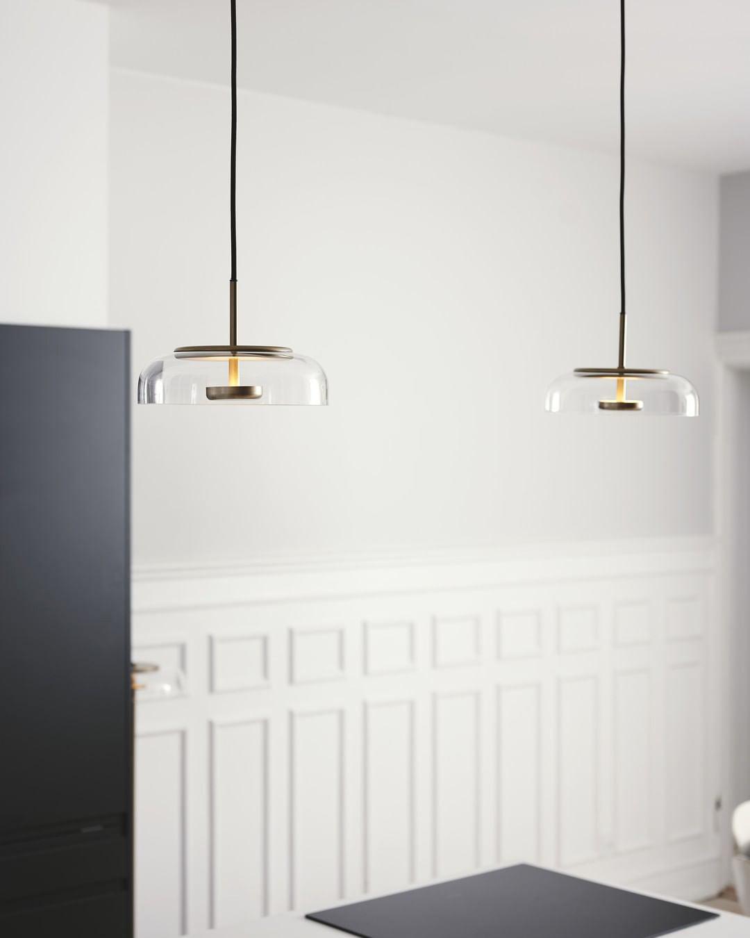 Blossi pendant light with a glass dome and circular inner metal elements