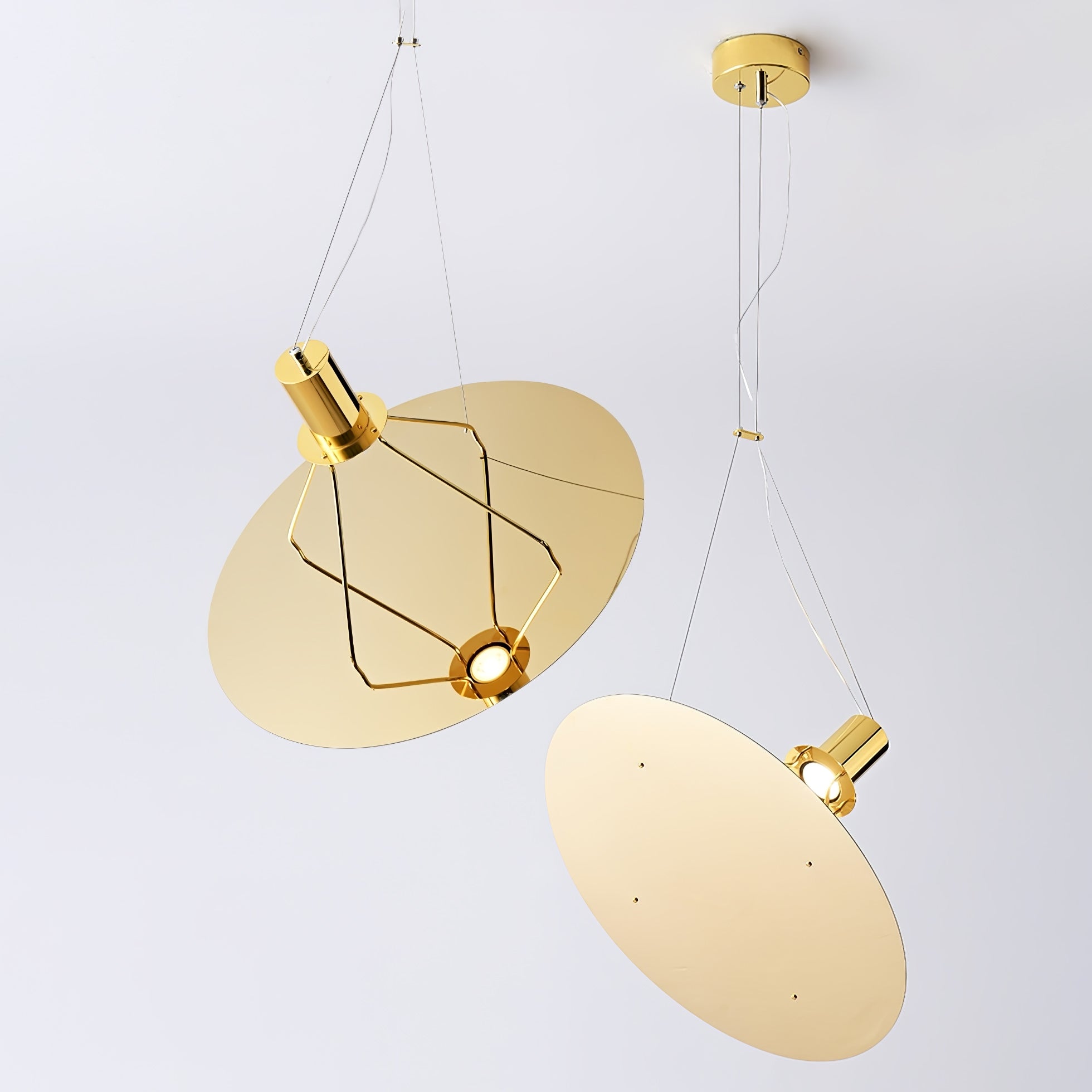 Two Gold reflector pendants at different angles