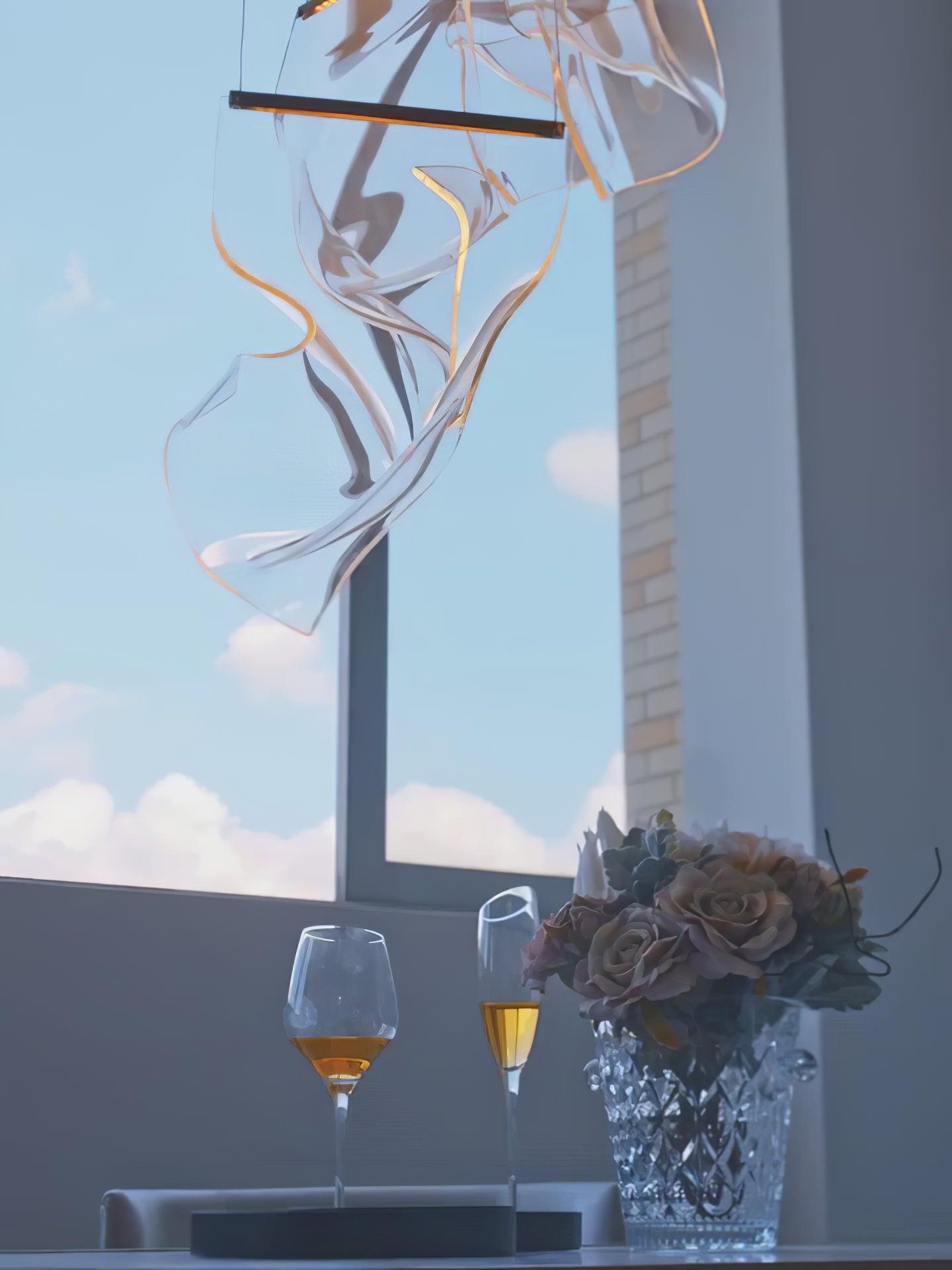 Transparent wavy light elements beside a window and flowers