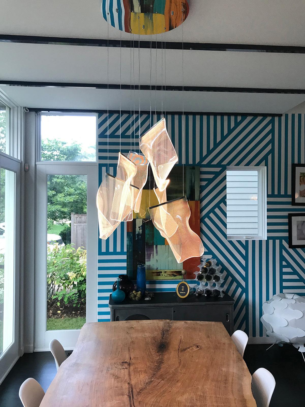 Warm-lit acrylic sheets above a wooden table